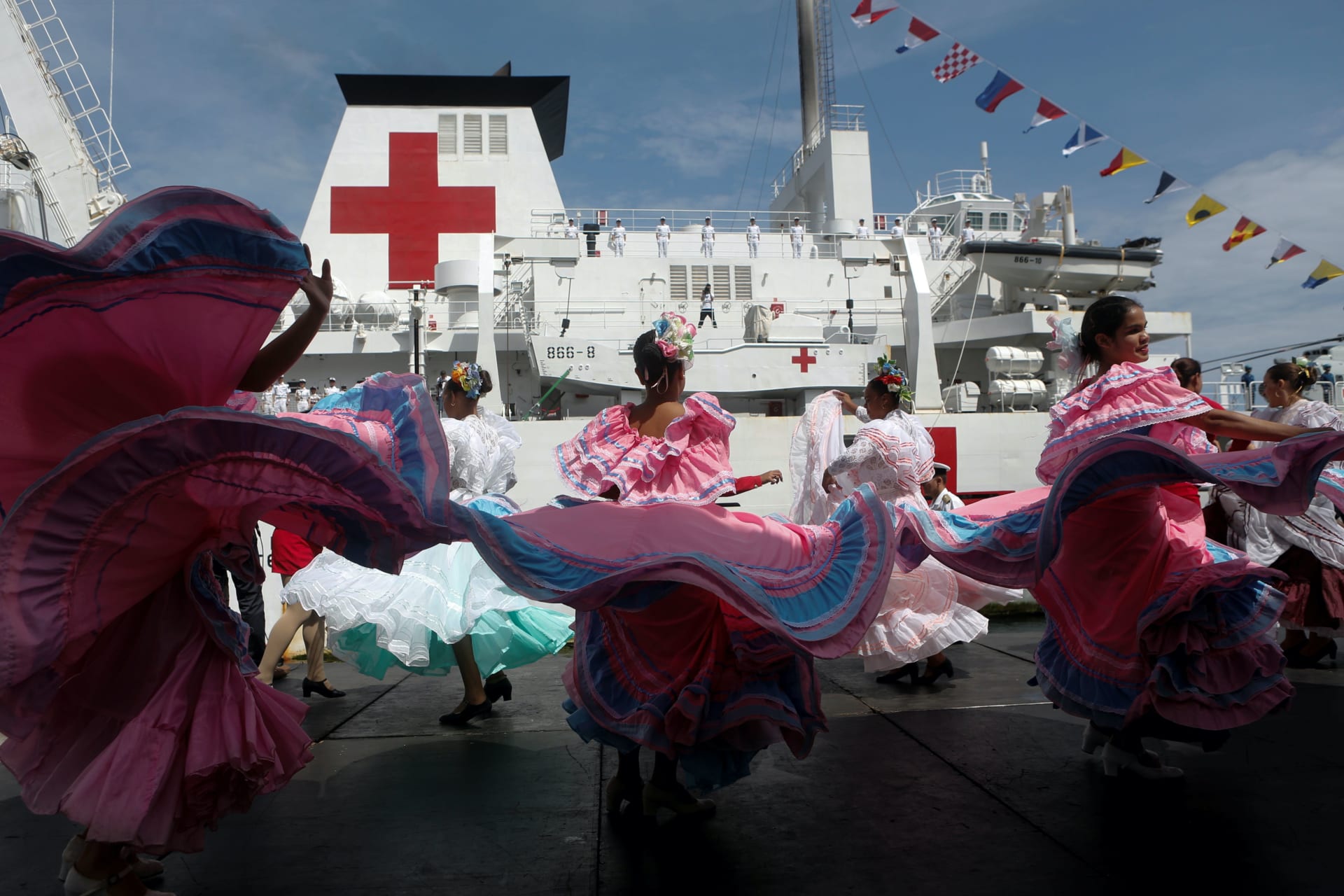 <p>Members of the Chinese People Liberation Army Navy stand at the China’s People’s Liberation Army (PLA) Navy hospital ship Peace Ark, during its arrival ceremony at the port in Venezuela on September 22, 2018.</p>