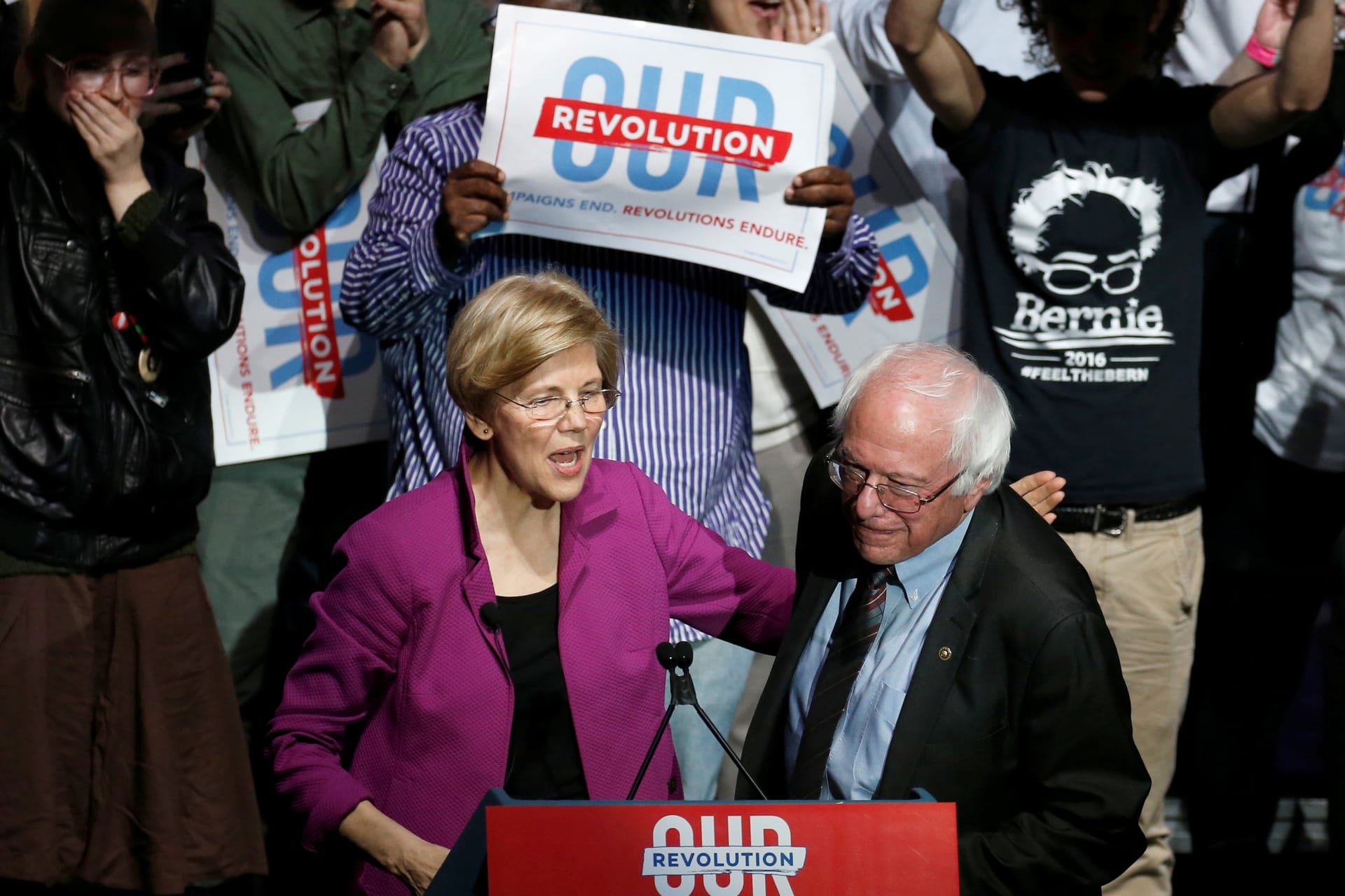 <p>U.S. Senator Elizabeth Warren puts her arm around U.S. Senator Bernie Sanders after introducing him at a rally in Boston, Massachusetts, on March 31, 2017. </p>