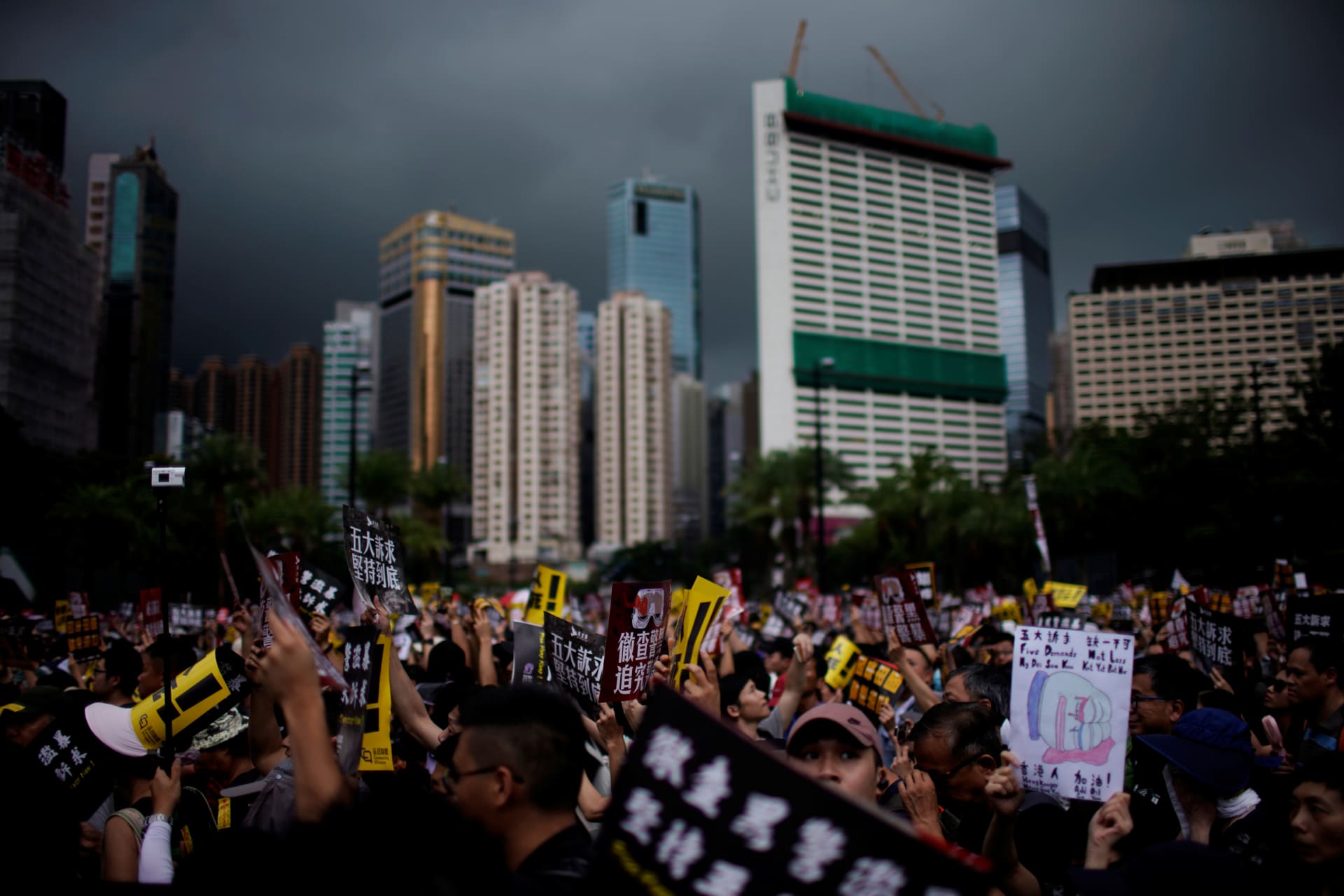 <p>Anti-extradition bill protesters march to demand democracy and political reforms, in Hong Kong on August 18, 2019.</p>