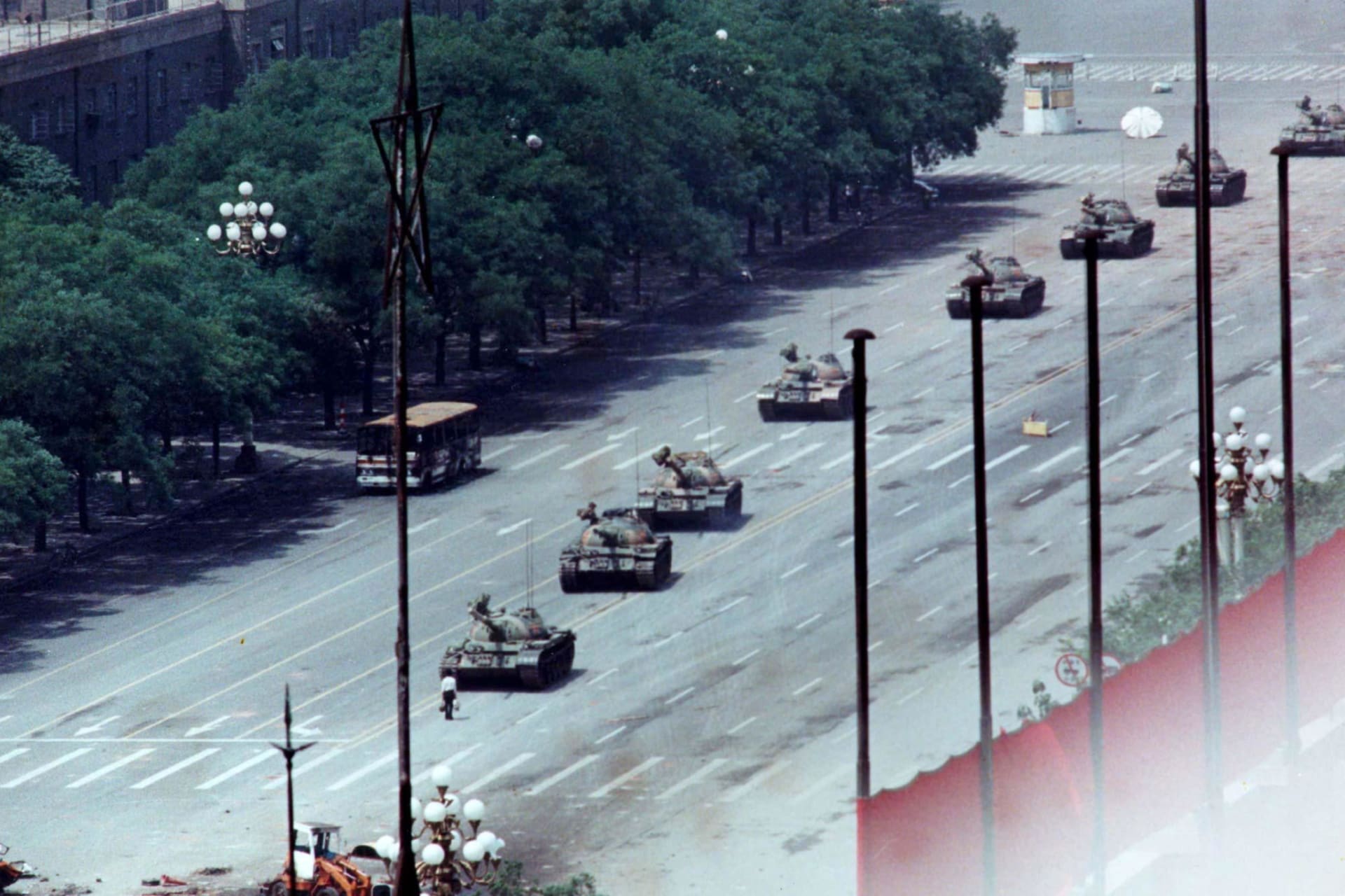 <p>A Beijing man stands in front of tanks on the Avenue of Eternal Peace.</p>