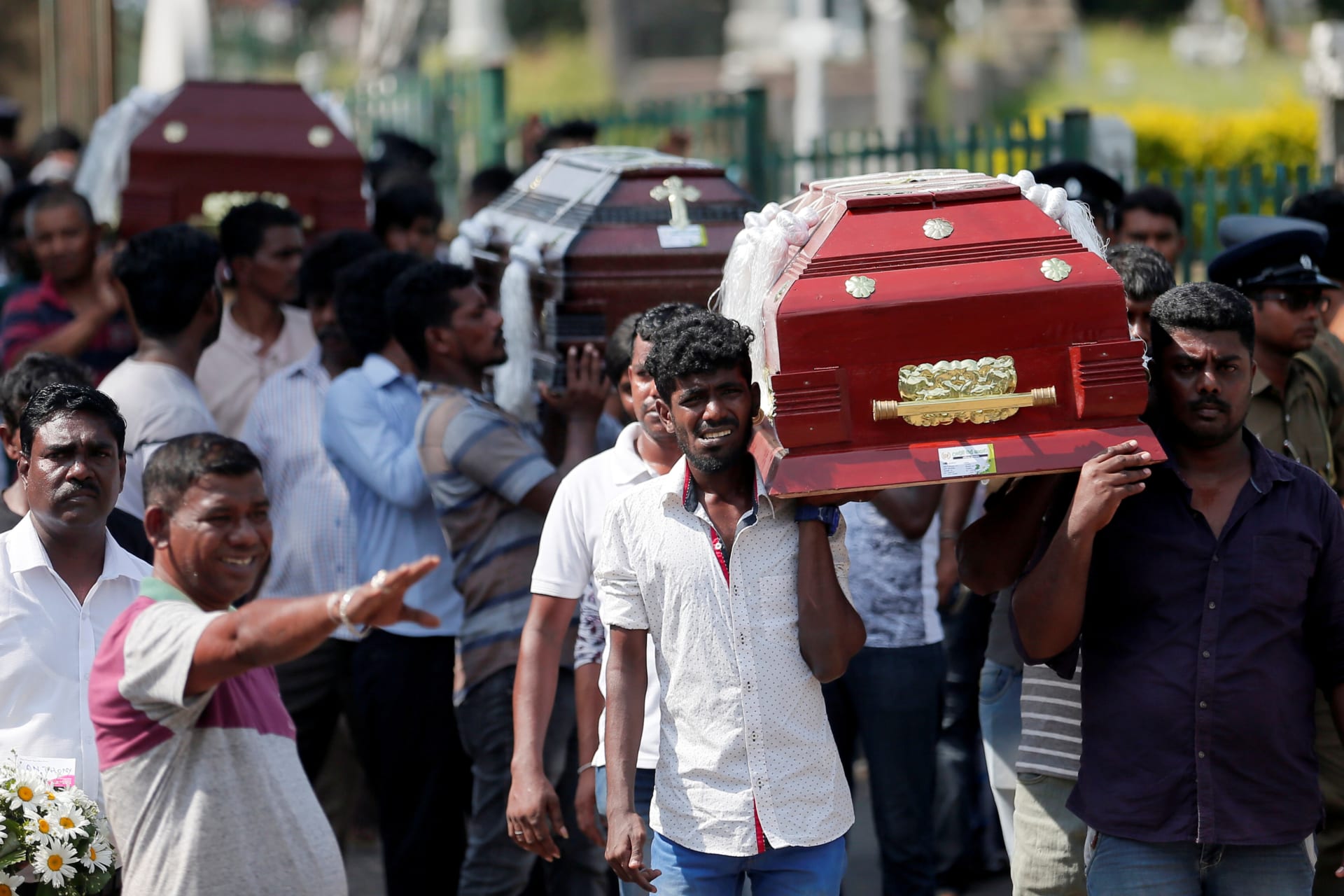 <p>Coffins of victims are carried in Colombo, Sri Lanka.</p>
