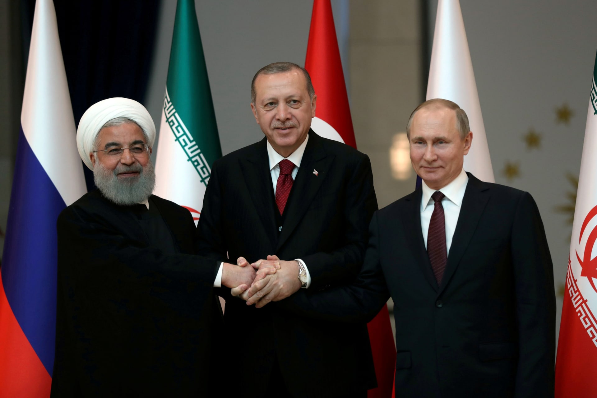 <p>Presidents Hassan Rouhani of Iran, Tayyip Erdogan of Turkey and Vladimir Putin of Russia pose before their meeting in Ankara, Turkey April 4, 2018. </p>
