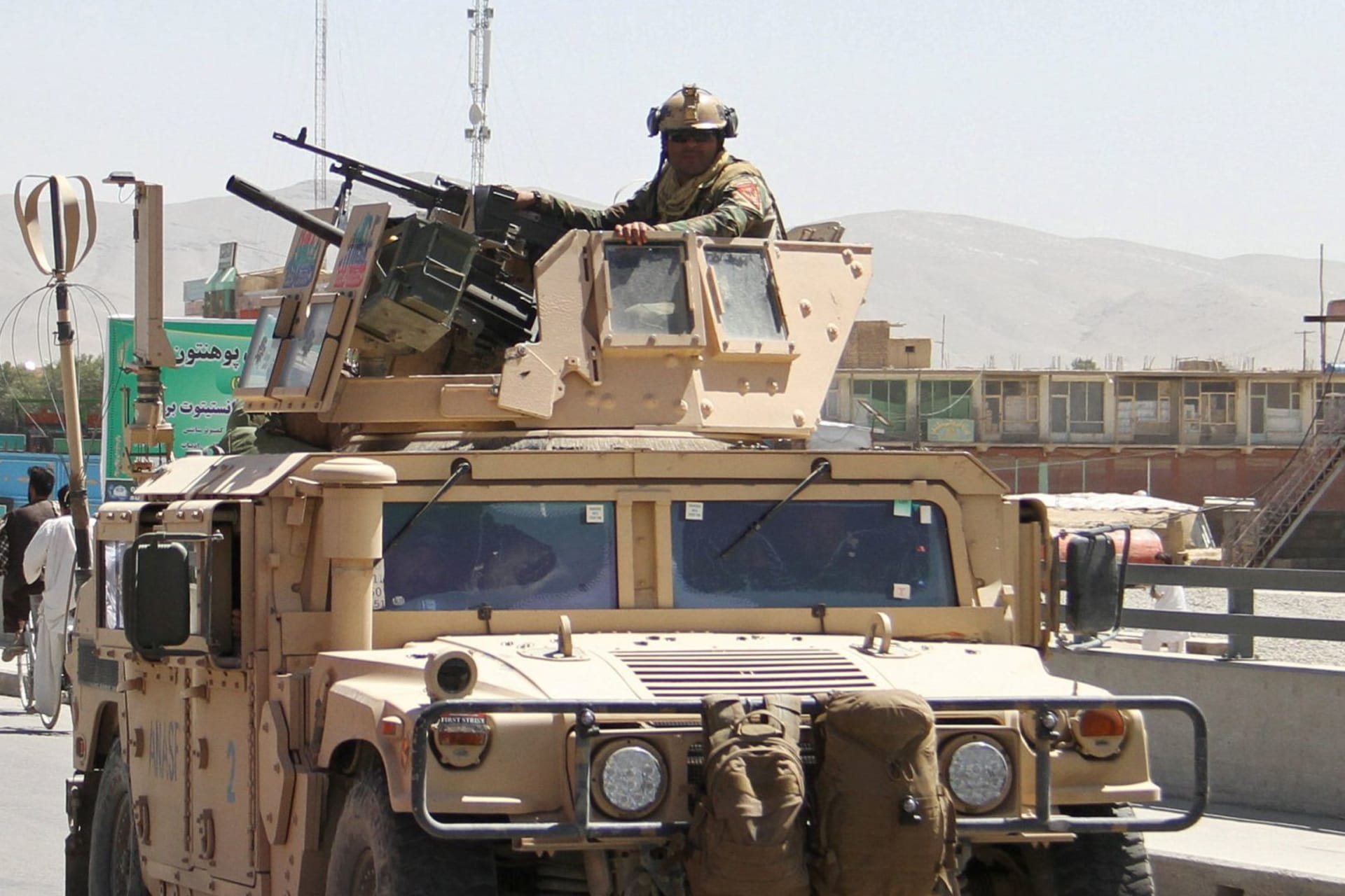 <p>An Afghan security forces convoy patrol after a Taliban attack in Ghazni city, Afghanistan.</p>
