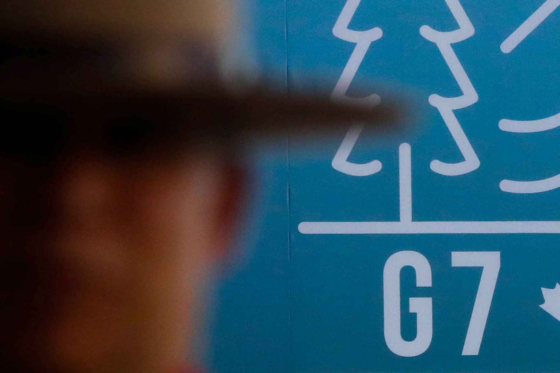 <p>A Canadian mounted police officer stands next to the G7 logo ahead of the G7 summit in Quebec, Canada.</p>

