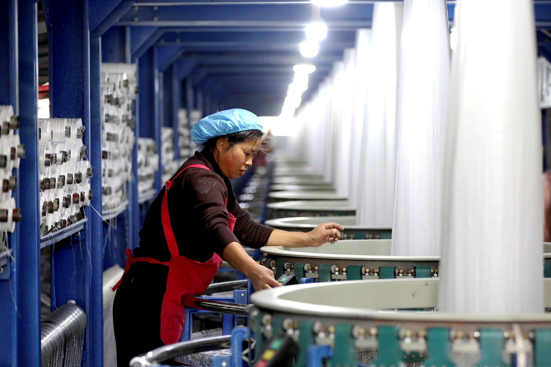 <p>An employee works on the assembly line of a factory manufacturing bags in Huai’an, China.</p>
