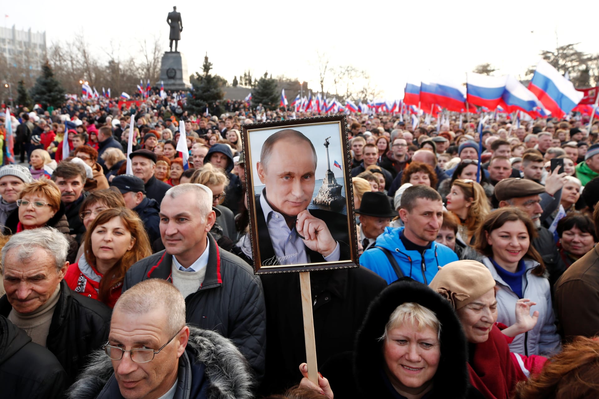 <p>People attend a rally marking the fourth anniversary of Russia’s annexation of Crimea.</p>
