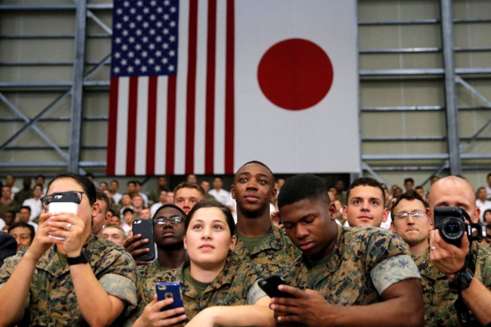 <p>U.S. and Japan Self-Defence Force’s soldiers listen a speech by U.S. President Barack Obama during his visits at Iwakuni Marine Corps Air Station, enroute to Hiroshima, Japan May 27, 2016. REUTERS/Carlos Barria</p>

