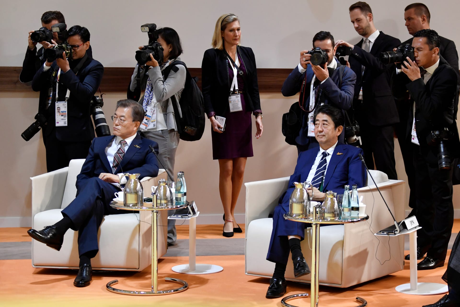 South Korea's President Moon Jae-in and Japan's Prime Minister Shinzo Abe sit at the start at the start of the "retreat meeting" on the first day of the G20 summit in Hamburg, Germany, July 7, 2017.