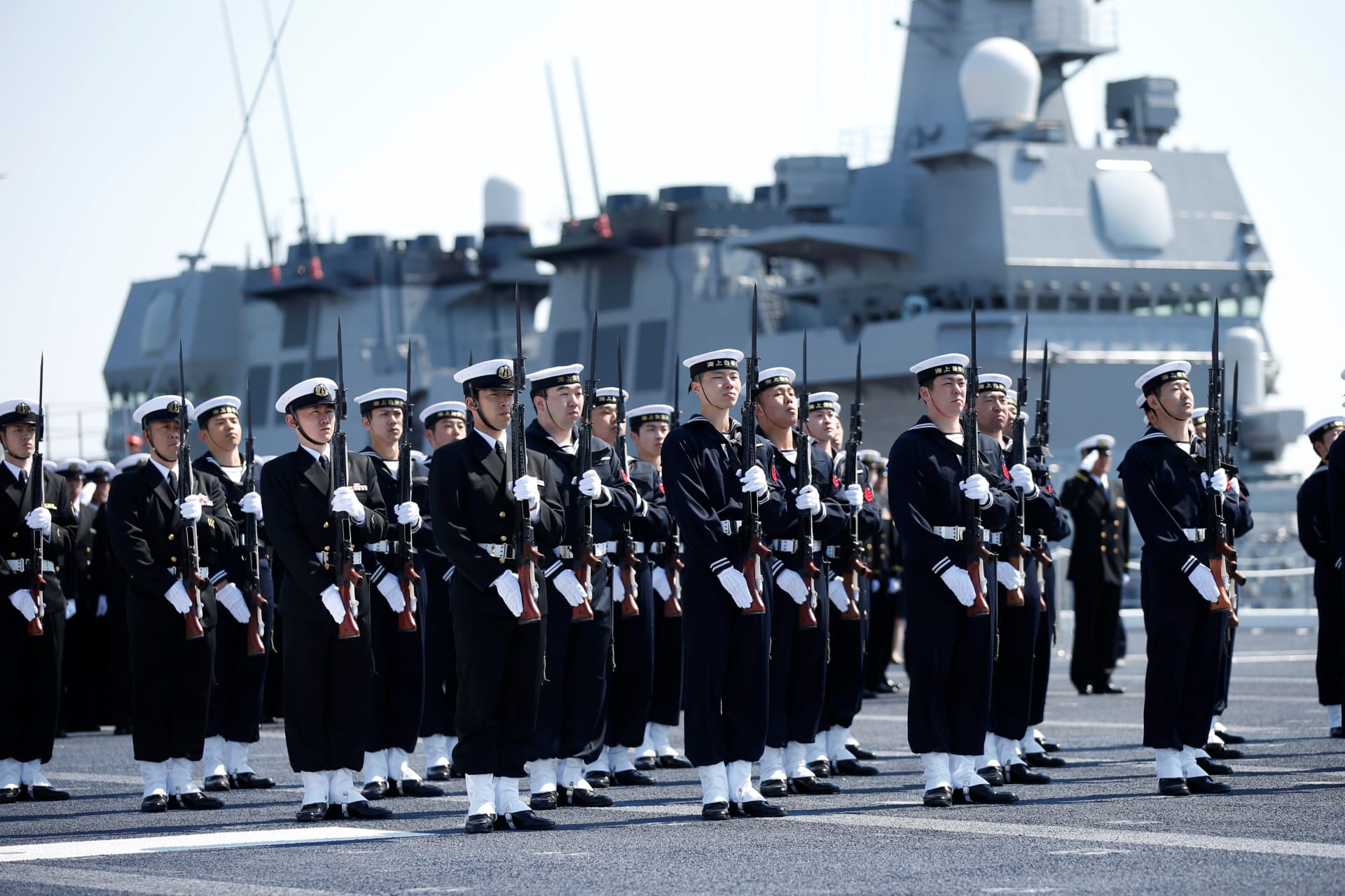 <p>Members of the Japan Maritime Self-Defense Force (JMSDF) attend a handover ceremony for the JMSDF latest Izumo-class helicopter carrier DDH-184 Kaga by Japan Marine United Corporation in Yokohama, Japan on March 22, 2017. </p>
