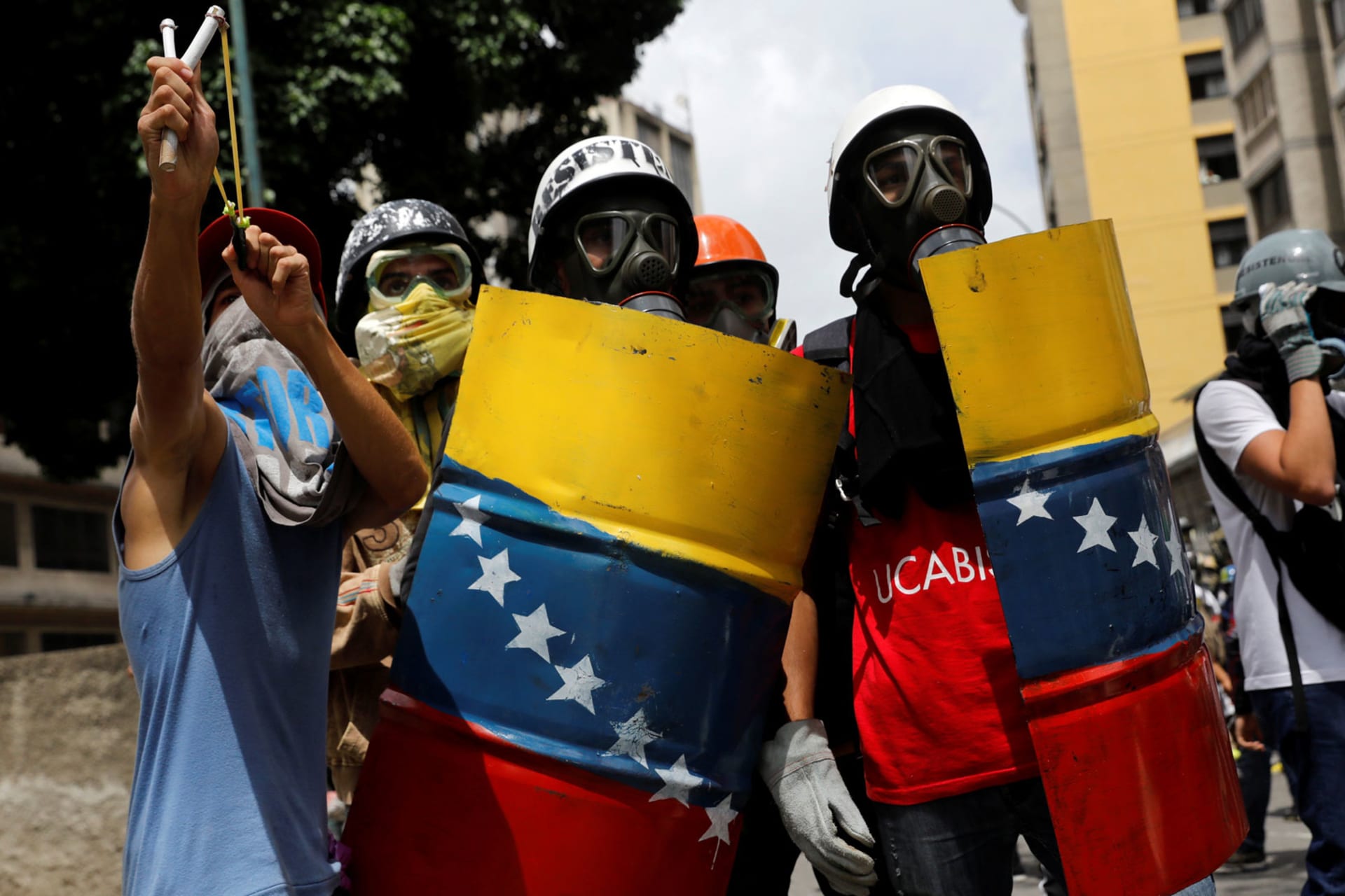 <p>Venezuelan demonstrators clash with riot police during anti-Maduro protests in Caracas, Venezuela on May 24, 2017.</p>
