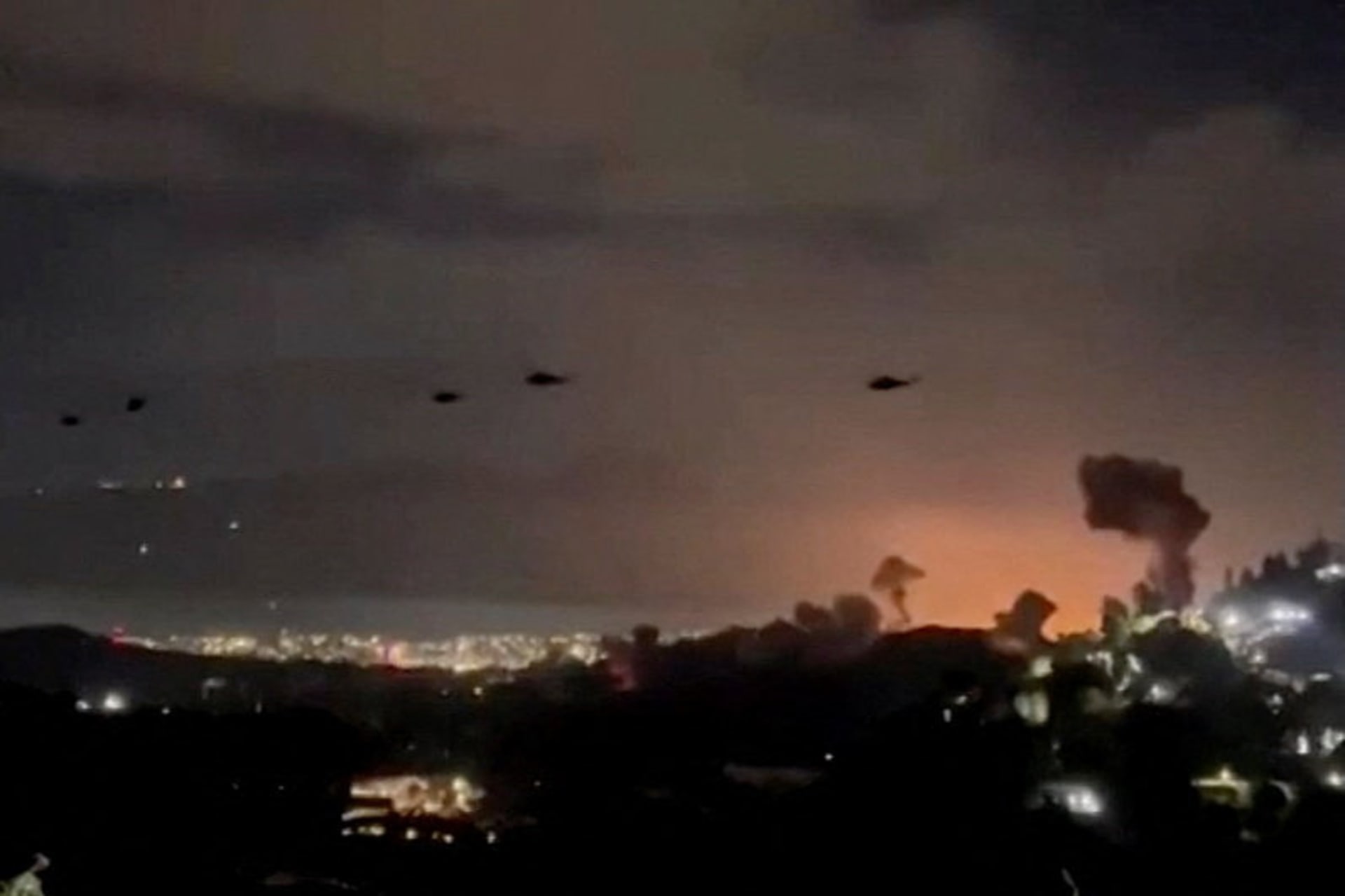 <p>Helicopters fly past plumes of smoke rising from explosions in Caracas, Venezuela, January 3, 2026.</p>
