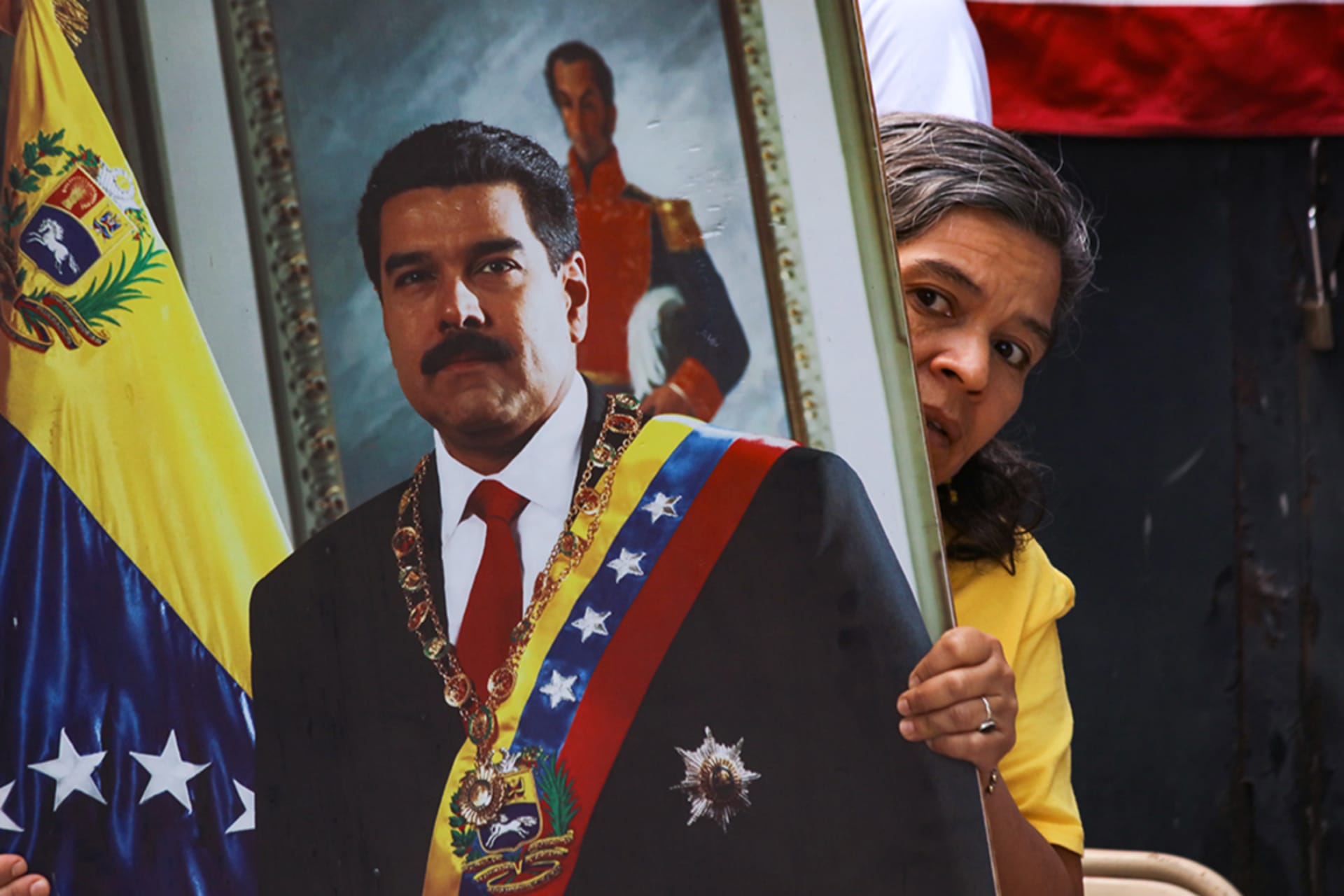 <p>A woman holds a portrait of Nicolas Maduro during a rally after the confirmation of Maduro’s capture in Caracas on January 3, 2026 in San Salvador, El Salvador.</p>
