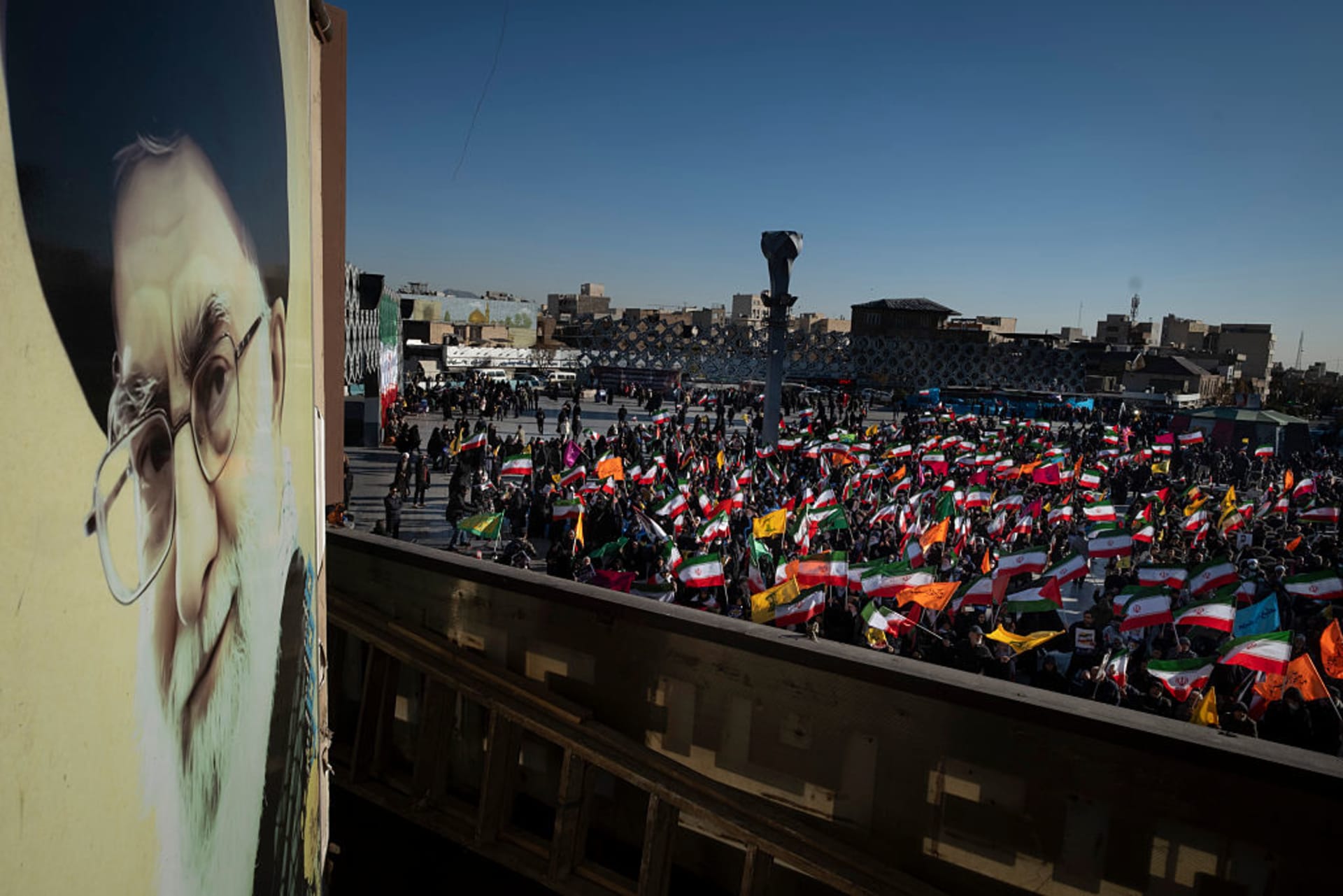 <p>Iranian people hold the national flags next to a portrait of Iran’s Supreme Leader, Ayatollah Ali Khamenei, during a pro-government rally in opposition to the recent protests in Iran in southern Tehran on December 30, 2025. </p>
