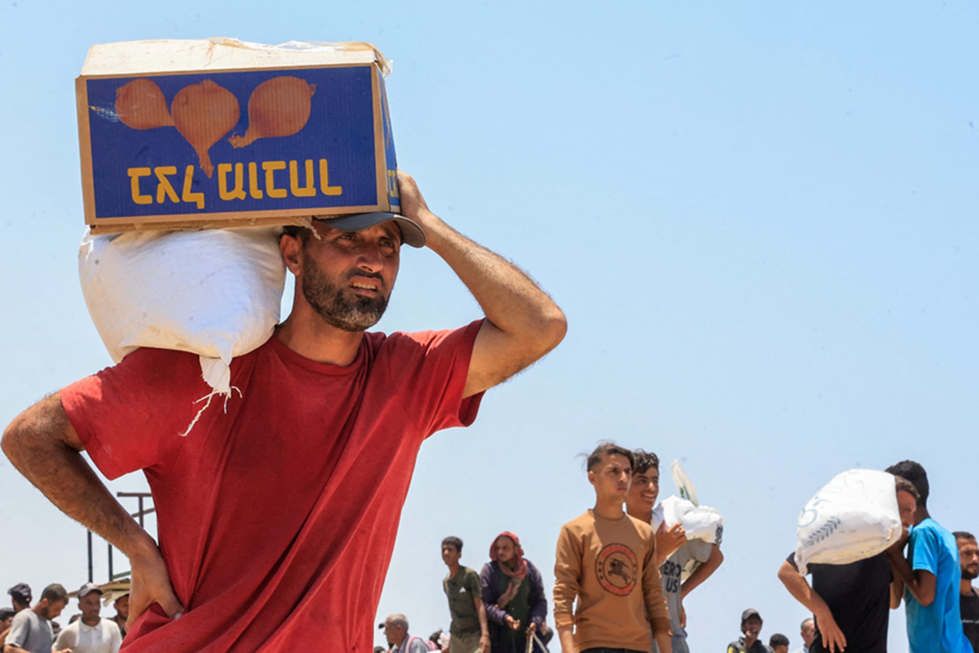 <p>A Palestinian collects aid supplies from the U.S.-backed Gaza Humanitarian Foundation, in Rafah, in the southern Gaza Strip, on June 9, 2025.</p>
