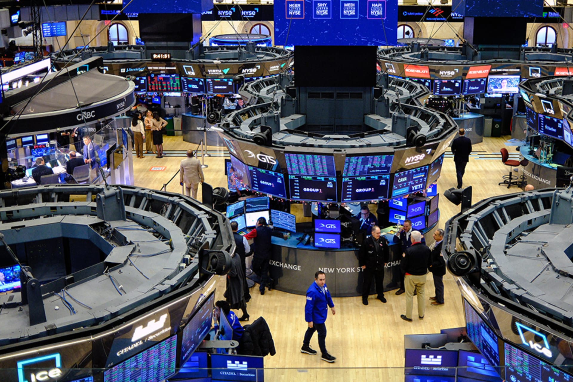 <p>Traders work on the floor of the New York Stock Exchange on December 16, 2025.</p>

