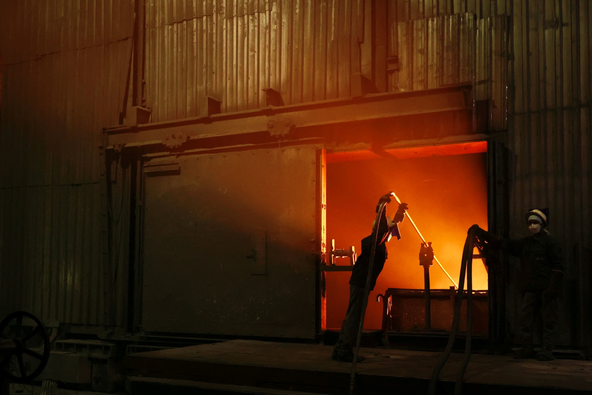 <p>Employees work at a furnace on a steel production line at the Jindal Stainless facility in Hisar, Haryana, India, May 30, 2025. </p>
