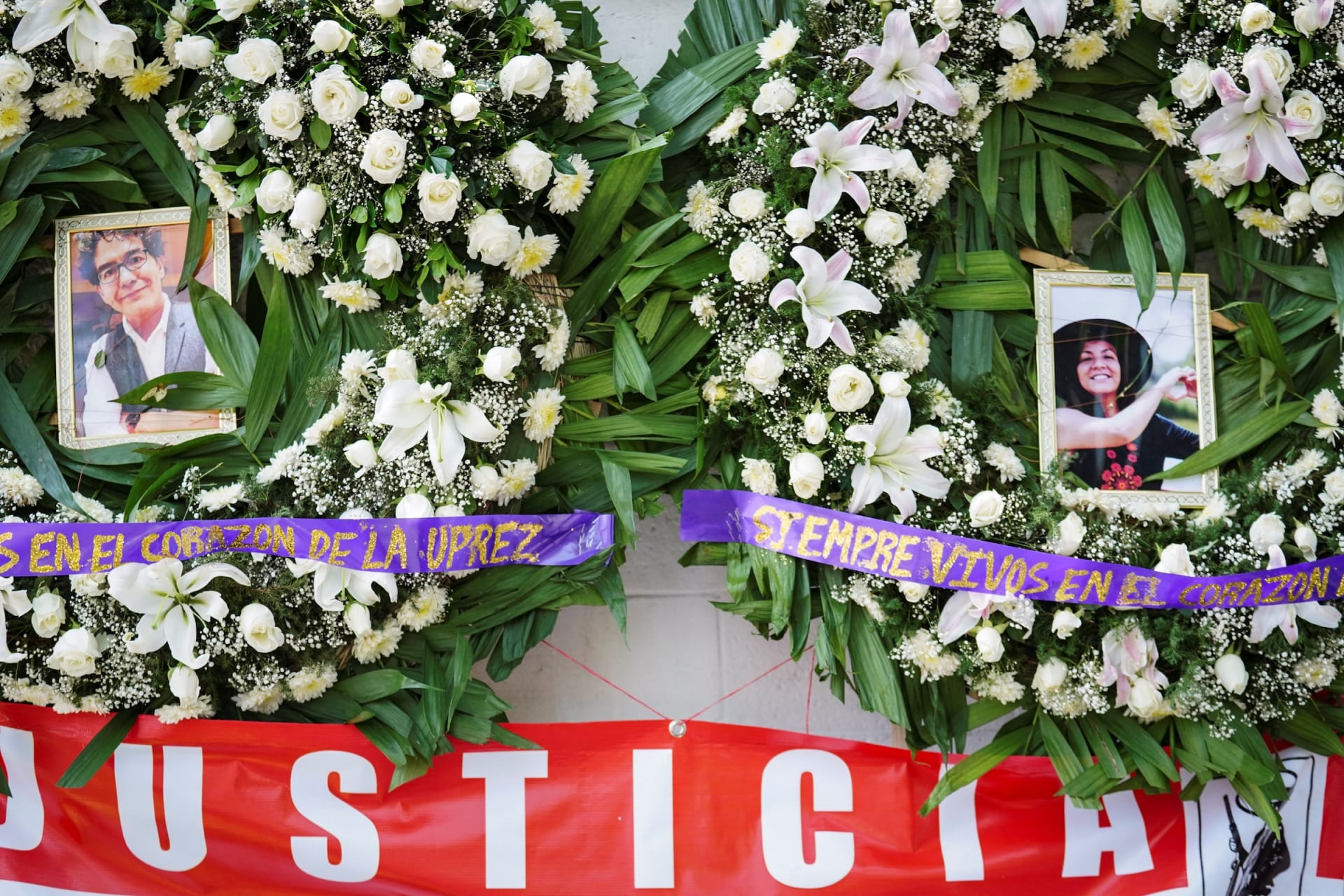 Wreaths with photographs of Jose Munoz Vega and Ximena Guzman Cuevas, two top aides of Mexico City Mayor Clara Brugada who were shot dead on Tuesday, are placed outside a funeral home in Mexico City
