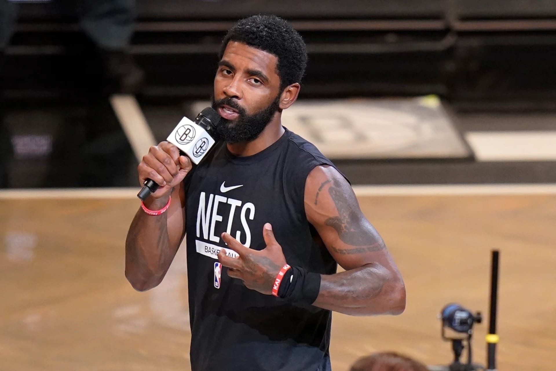 <p>Nets guard Kyrie Irving addresses the crowd before a game on Oct. 19.</p>
