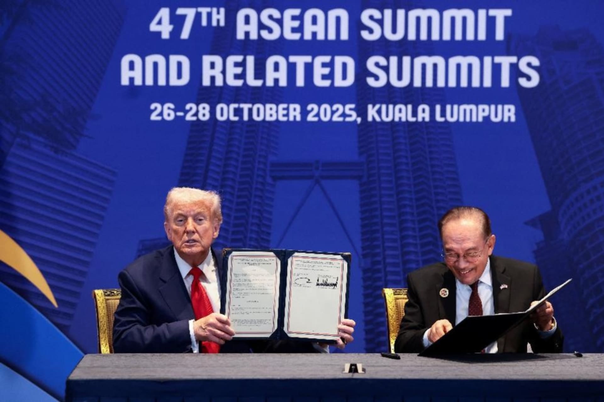 <p>U.S. President Donald Trump and Malaysian Prime Minister Anwar Ibrahim hold up trade deal documents during a bilateral meeting at the 47th Association of Southeast Asian Nations (ASEAN) summit in Kuala Lumpur, Malaysia on October 26, 2025.</p>
