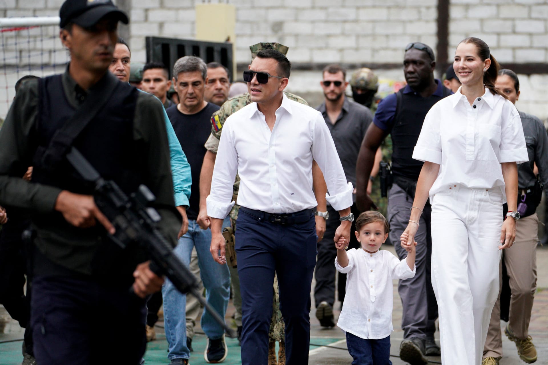Photo of President Daniel Noboa walking with his family on the day of Ecuador's presidential election