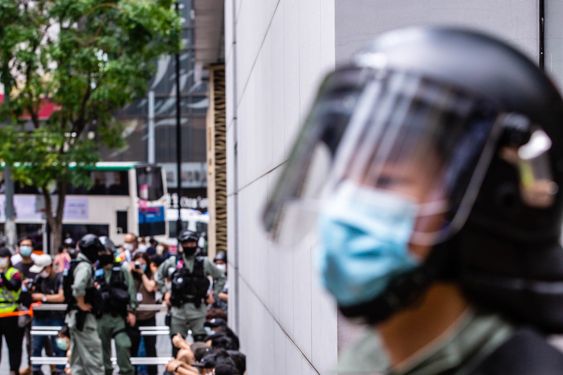 Riot police round up a group of protesters during the