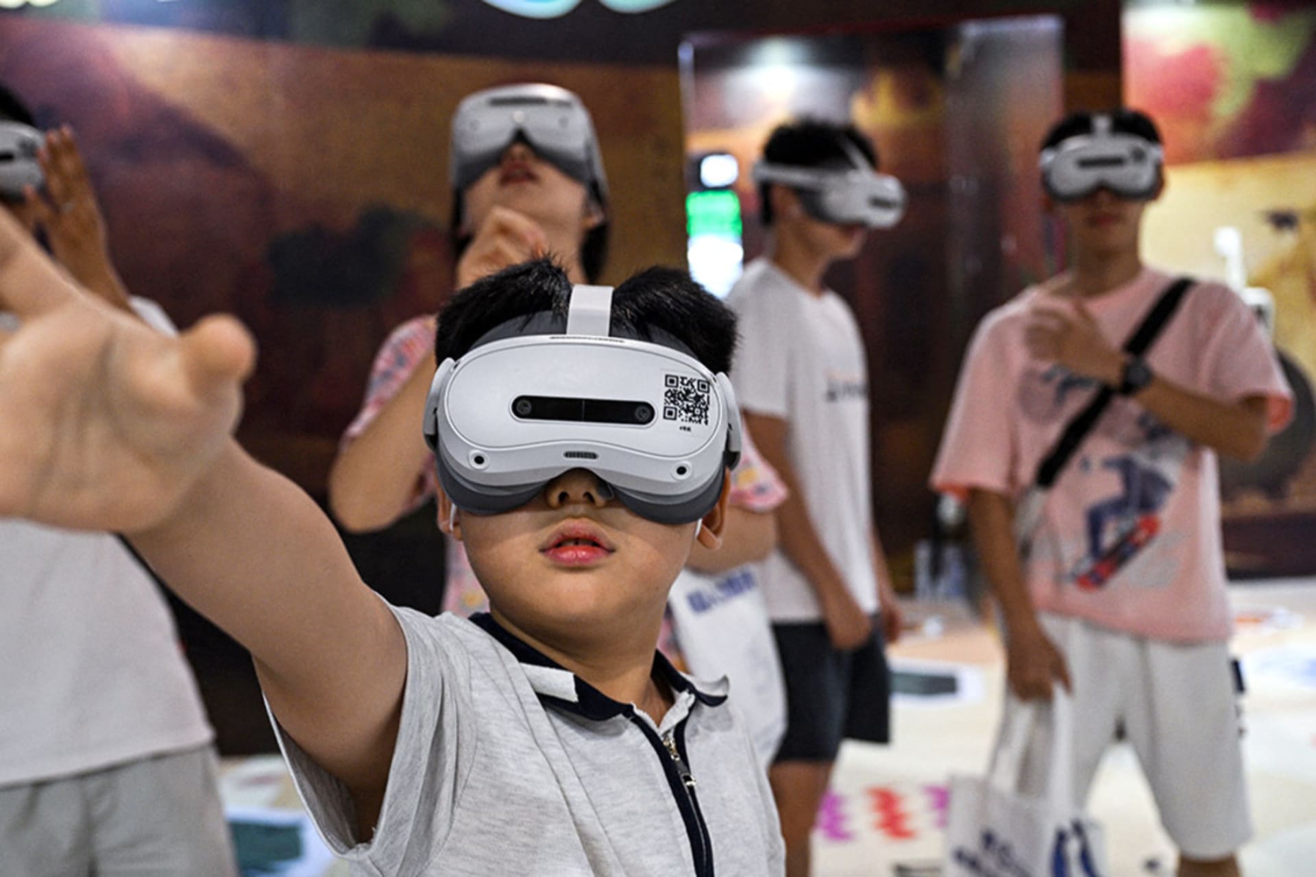 <p>People use augmented reality headsets during the World Artificial Intelligence Conference (WAIC) in Shanghai on July 28, 2025. </p>
