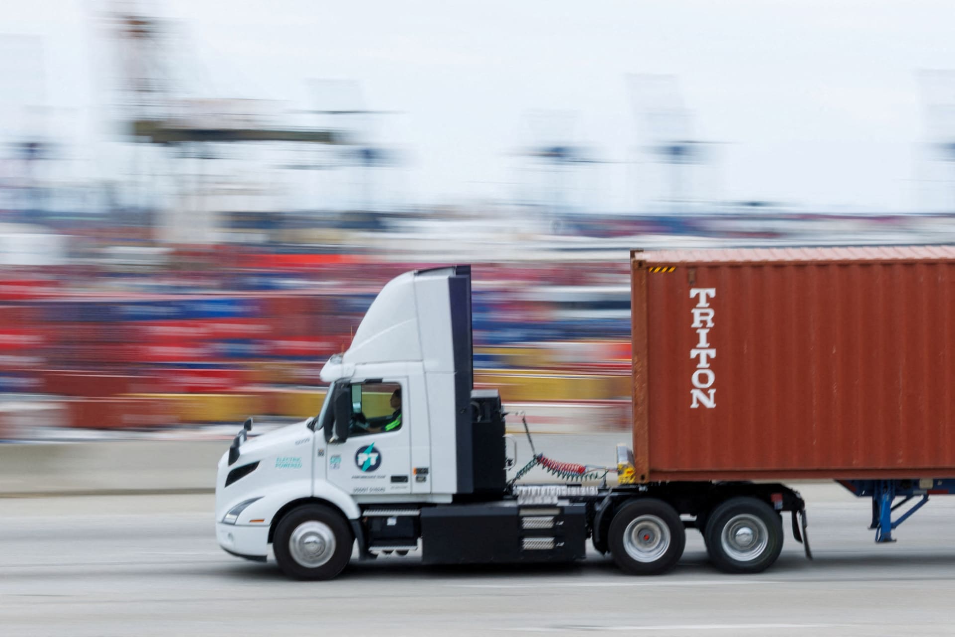 <p>A semi-truck drives past Chinese shipping containers at the Port of Los Angeles in Wilmington, California, U.S., November 5, 2025.</p>
