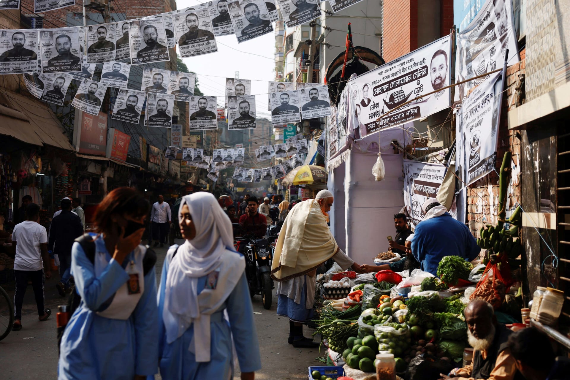 <p>Election posters hanging above a street in Dhaka, Bangladesh, January 2024</p>
