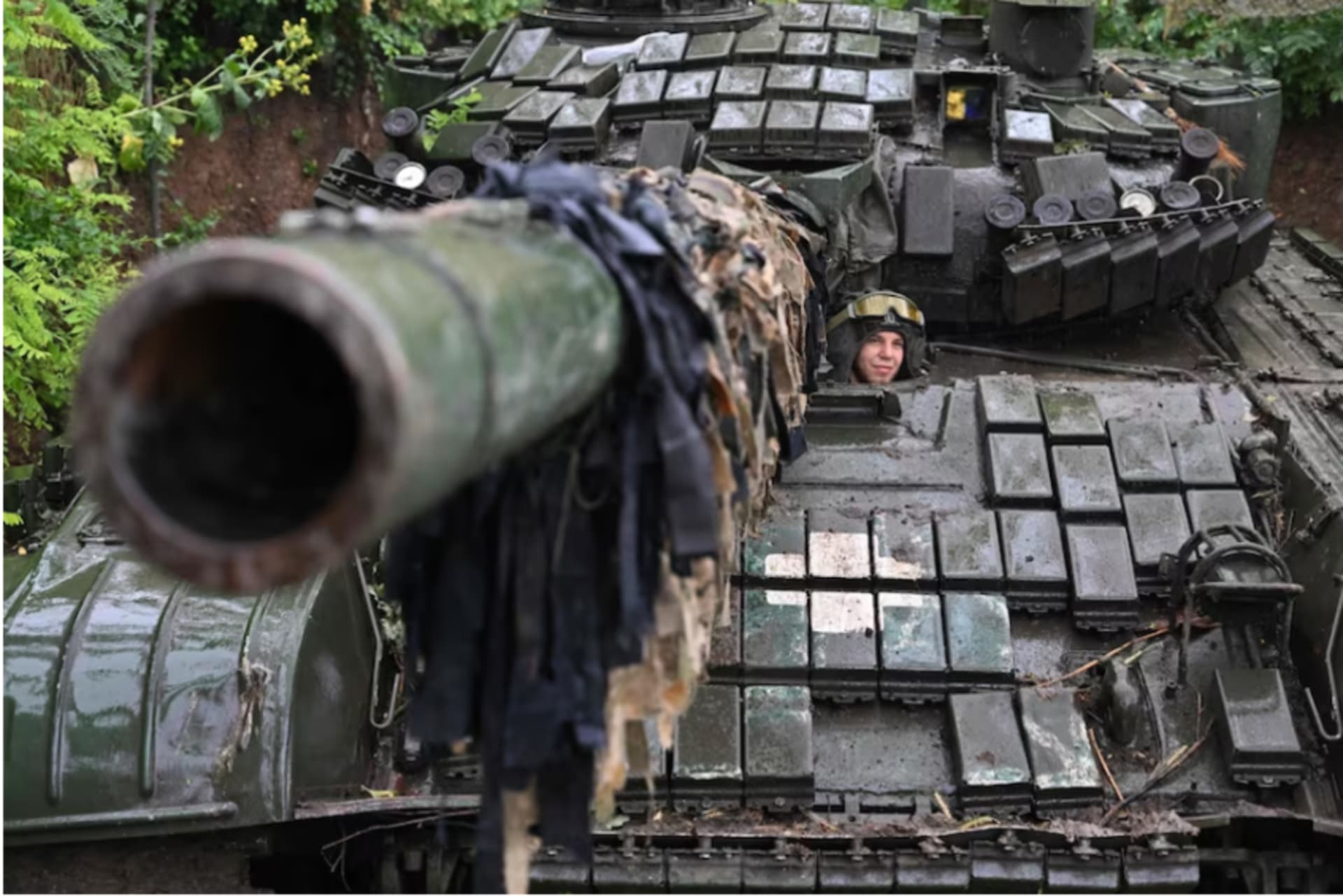 <p>A Ukrainian serviceman is seen in a T-72 tank in the Donetsk region of Ukraine on June 25.</p>
