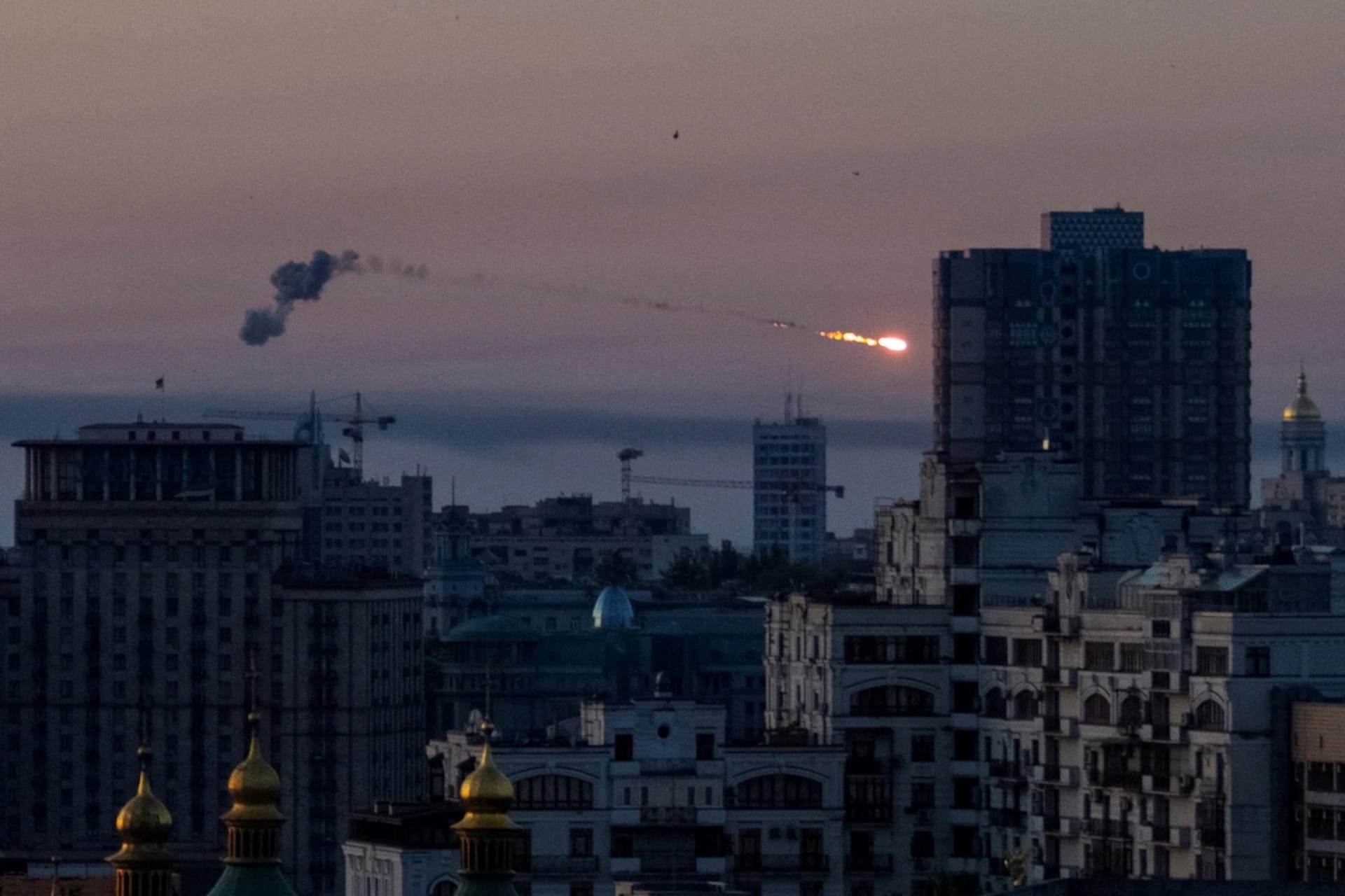<p>An explosion of a missile is seen in the sky over Kyiv, Ukraine, during a Russian missile strike, on Thursday. </p>
