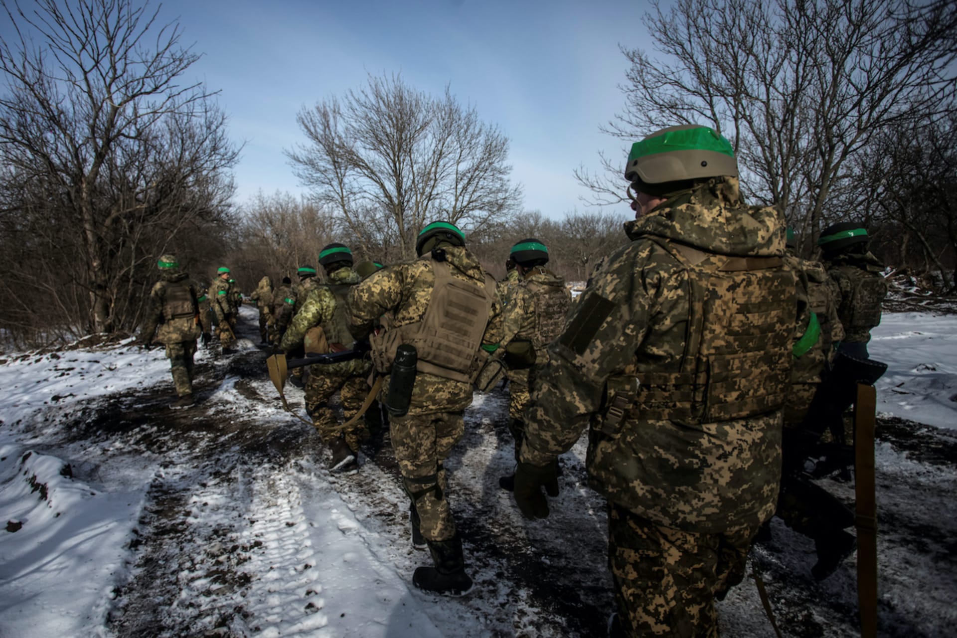 <p>Ukrainian servicemen walk on a road outside the frontline town of Bakhmut.</p>
