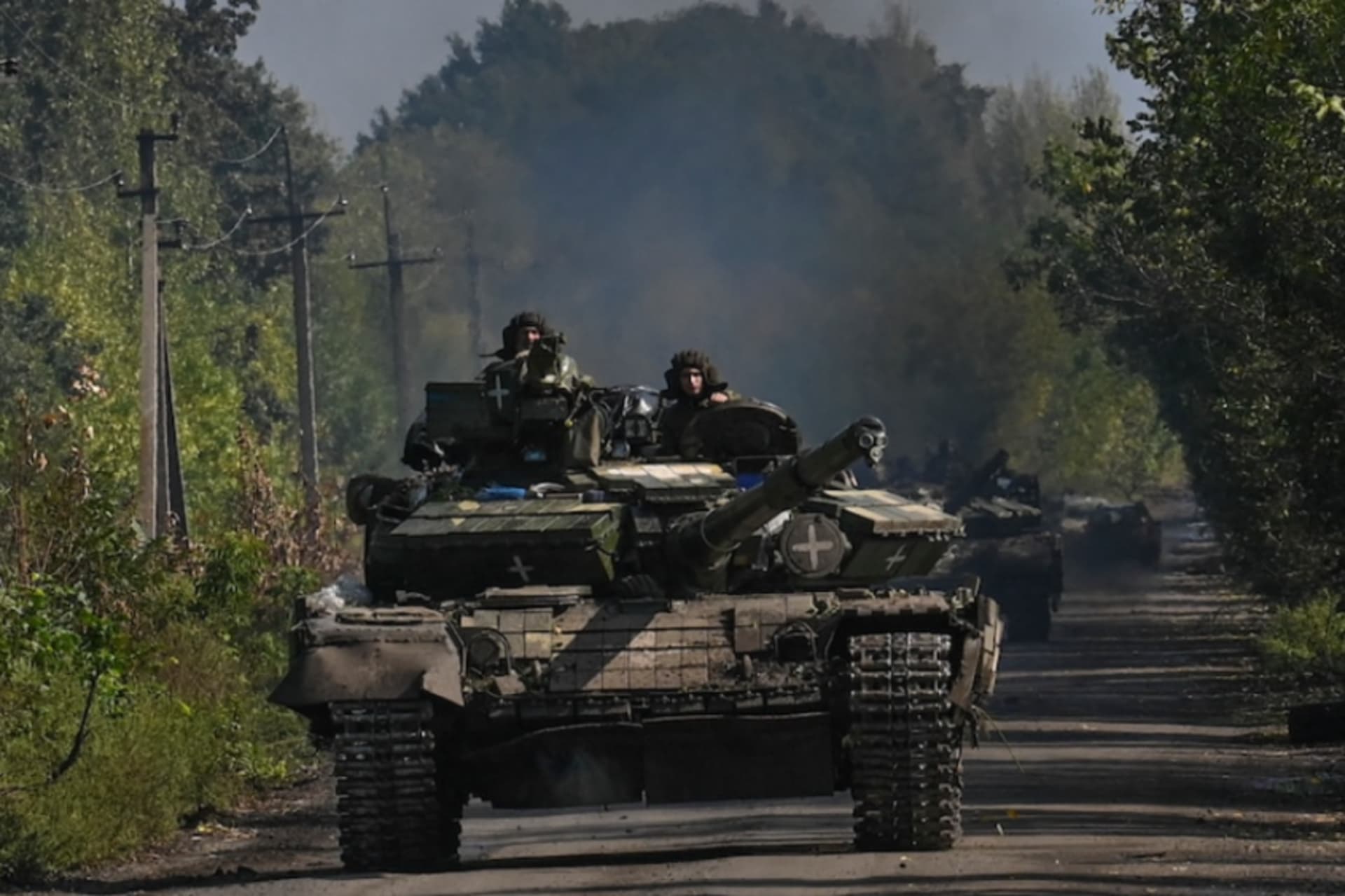 <p>Ukrainian soldiers ride a tank in Novoselivka on Sept. 17.</p>
