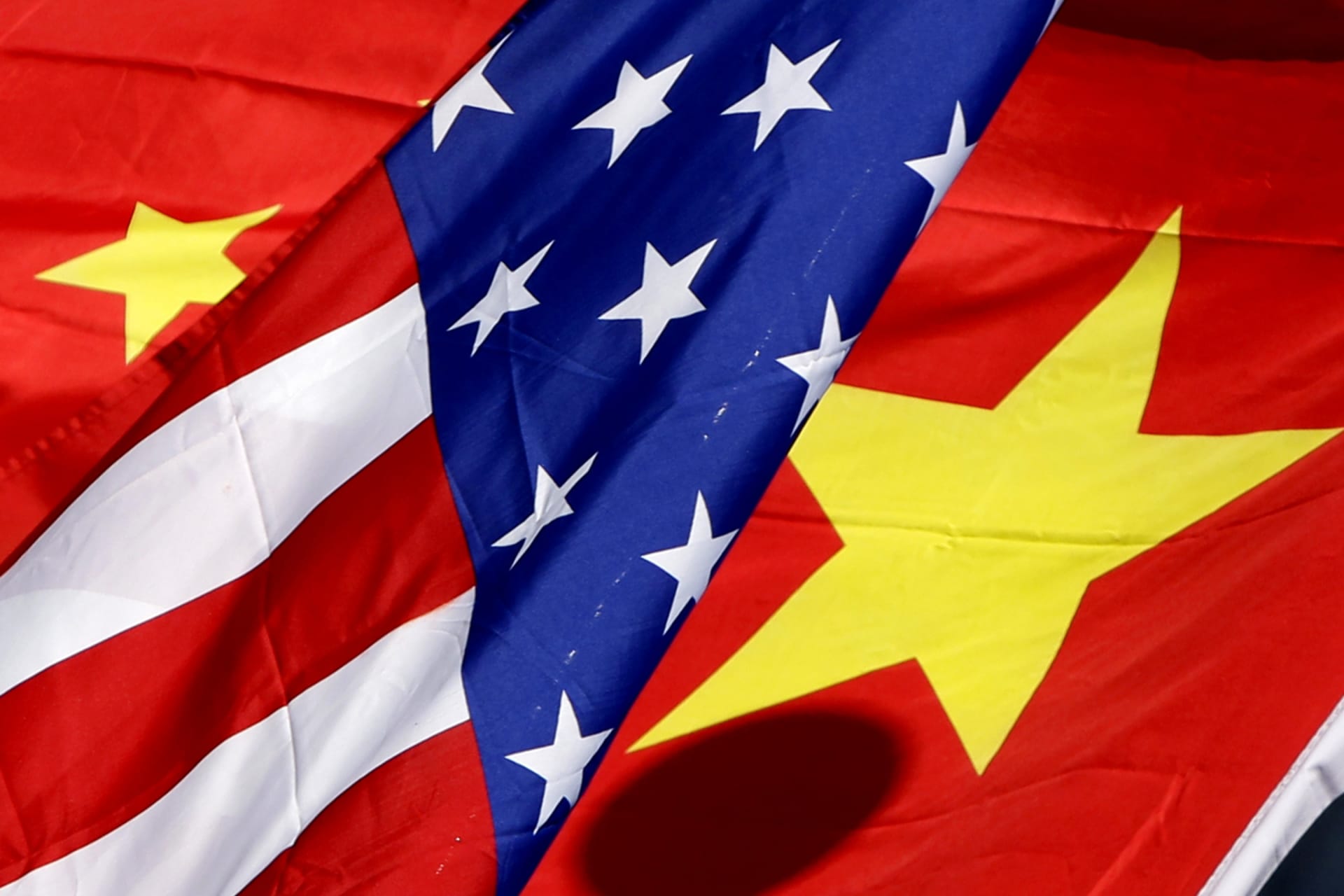 <p>The national flags of the U.S. and China wave in front of an international hotel in Beijing January 17, 2011. Chinese President Hu Jintao visits the United States on Jan. 18-21 for a visit that is being billed as the most important U-S.-China summit since</p>