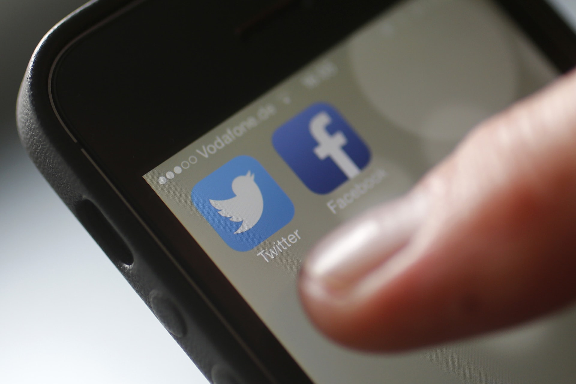 An illustration picture shows a man starting his Twitter App on a mobile device in Hanau near Frankfurt