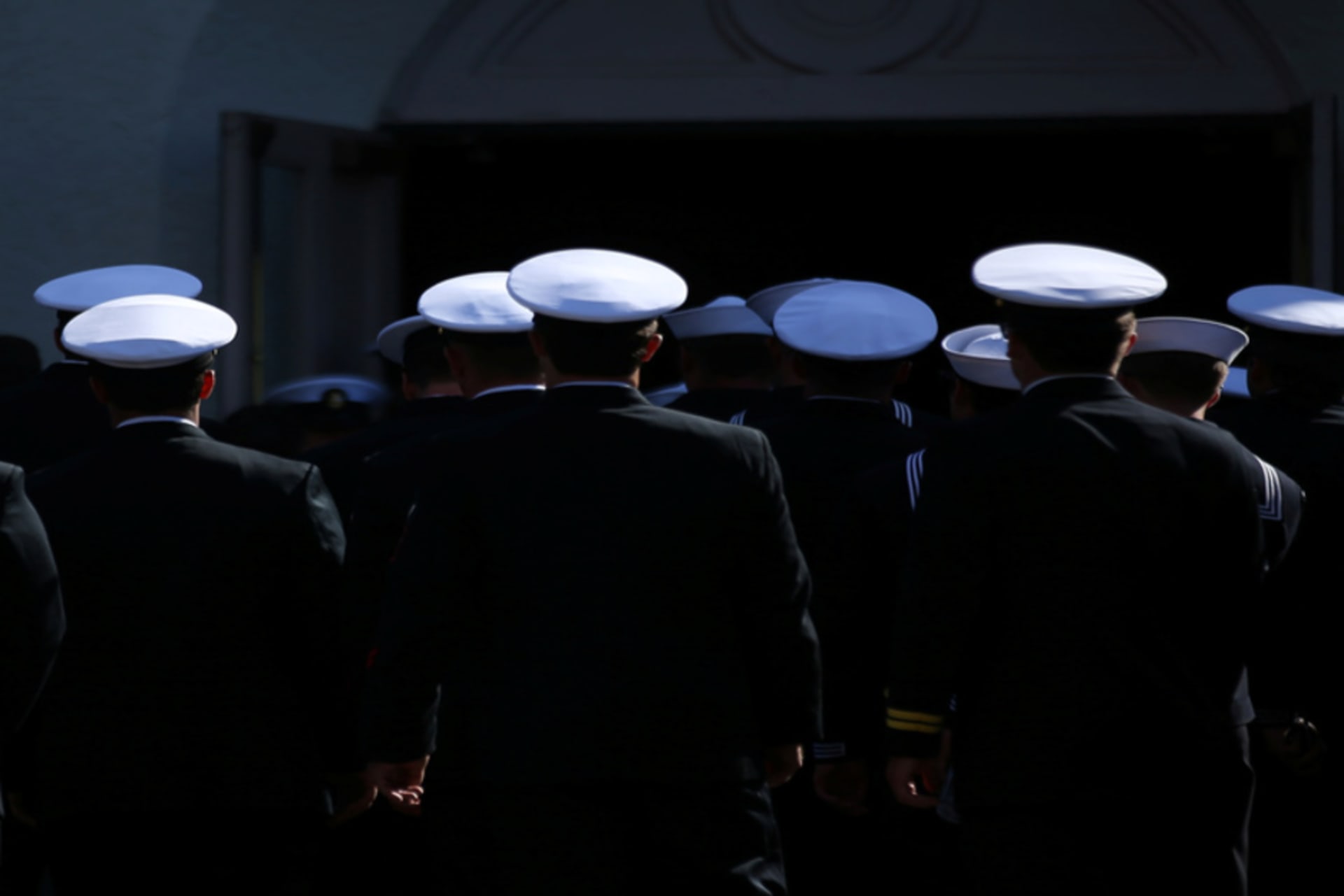 U.S. Navy sailors make their way into church for the funeral of Coronado-based Chief Petty Officer Jason C. Finan of Anaheim, in Coronado