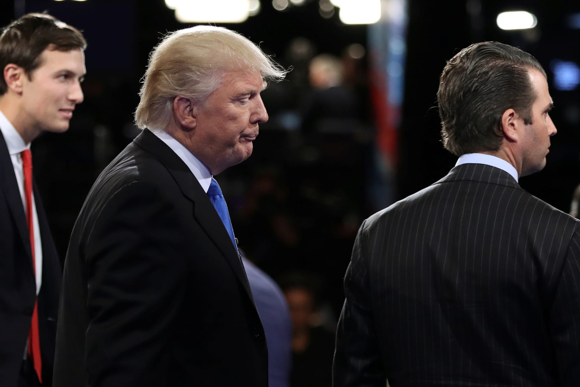 <p>President Donald Trump is flanked on stage by his son in law Jared Kushner on the left and his son Donald Trump Jr. on the right in this pool photo.</p>

