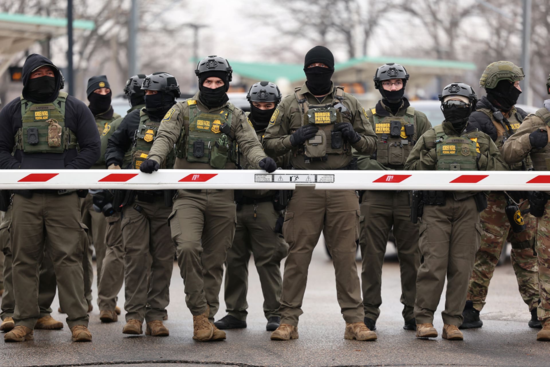<p>U.S. Border Patrol agents stand guard at the Bishop Henry Whipple Federal Building in Minneapolis, Minnesota, January 8, 2026.</p>
