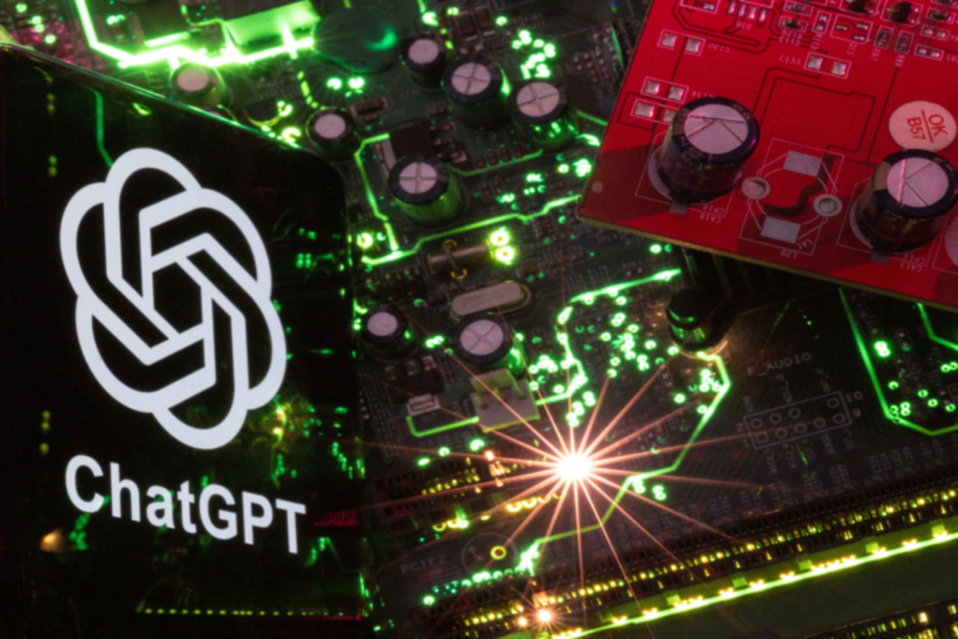 <p>ChatGPT logo overlayed on a green circuit board</p>

