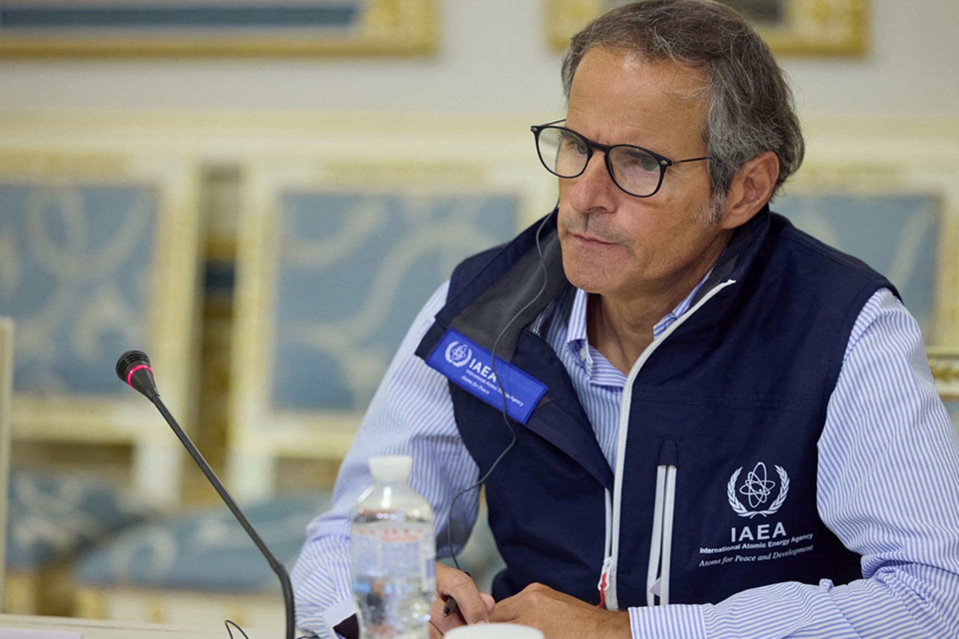 Rafael Mariano Grossi sitting by mic