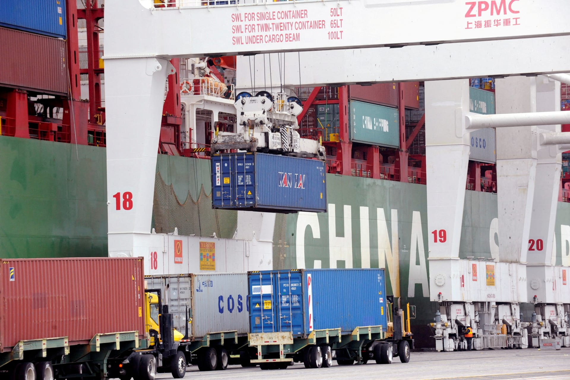 Shipping containers wait for processing