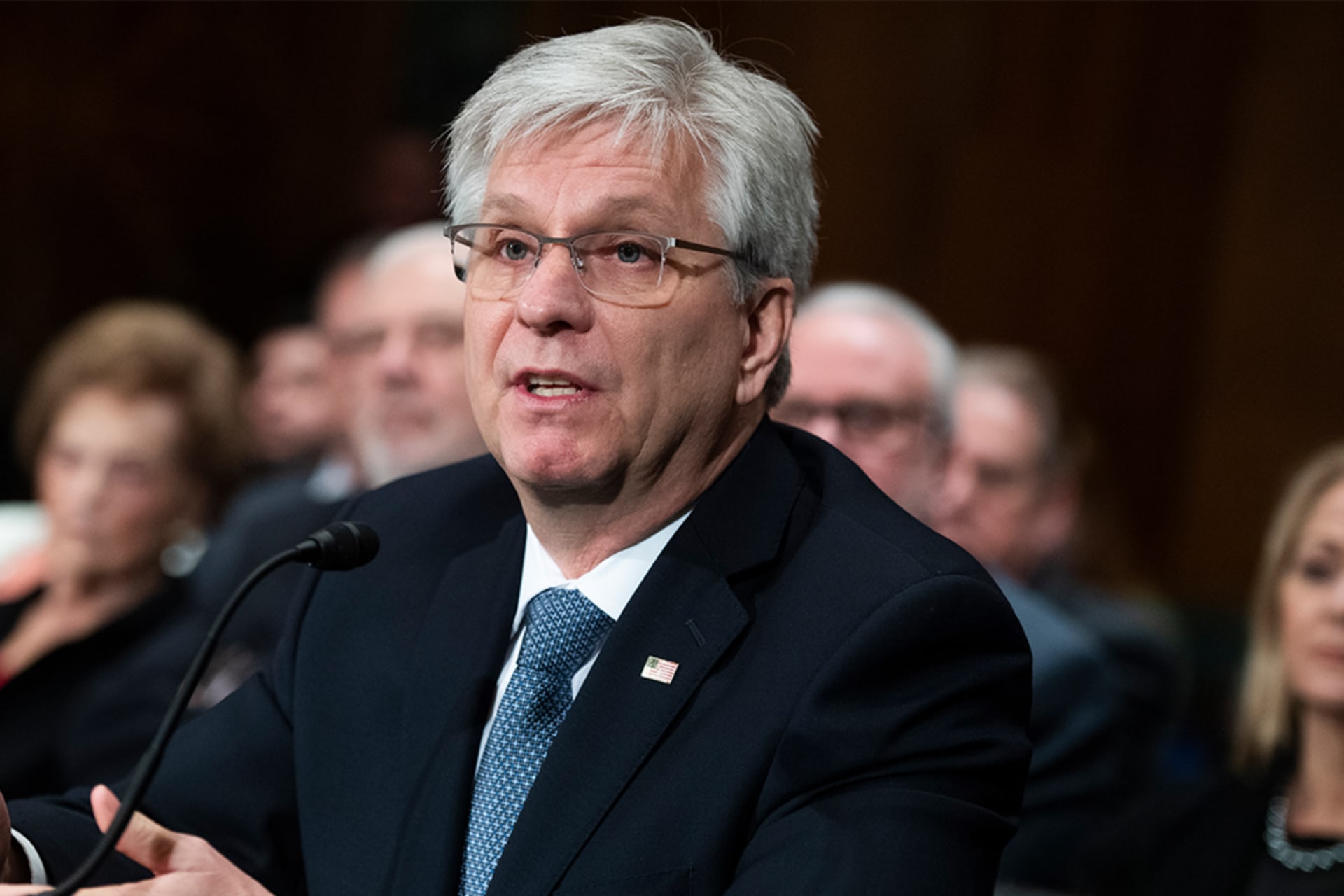 Christopher J. Waller at Congressional hearing in suit