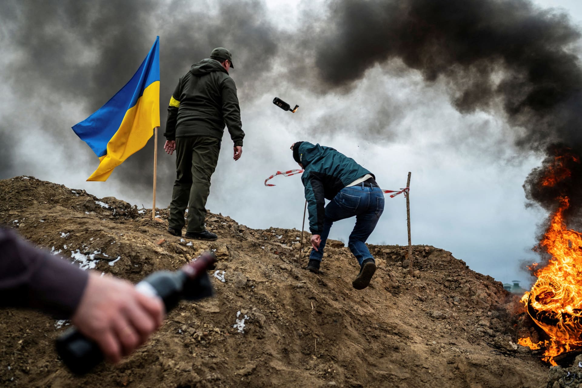 <p>A civilian trains to throw Molotov cocktails, as Russia’s invasion of Ukraine continues</p>