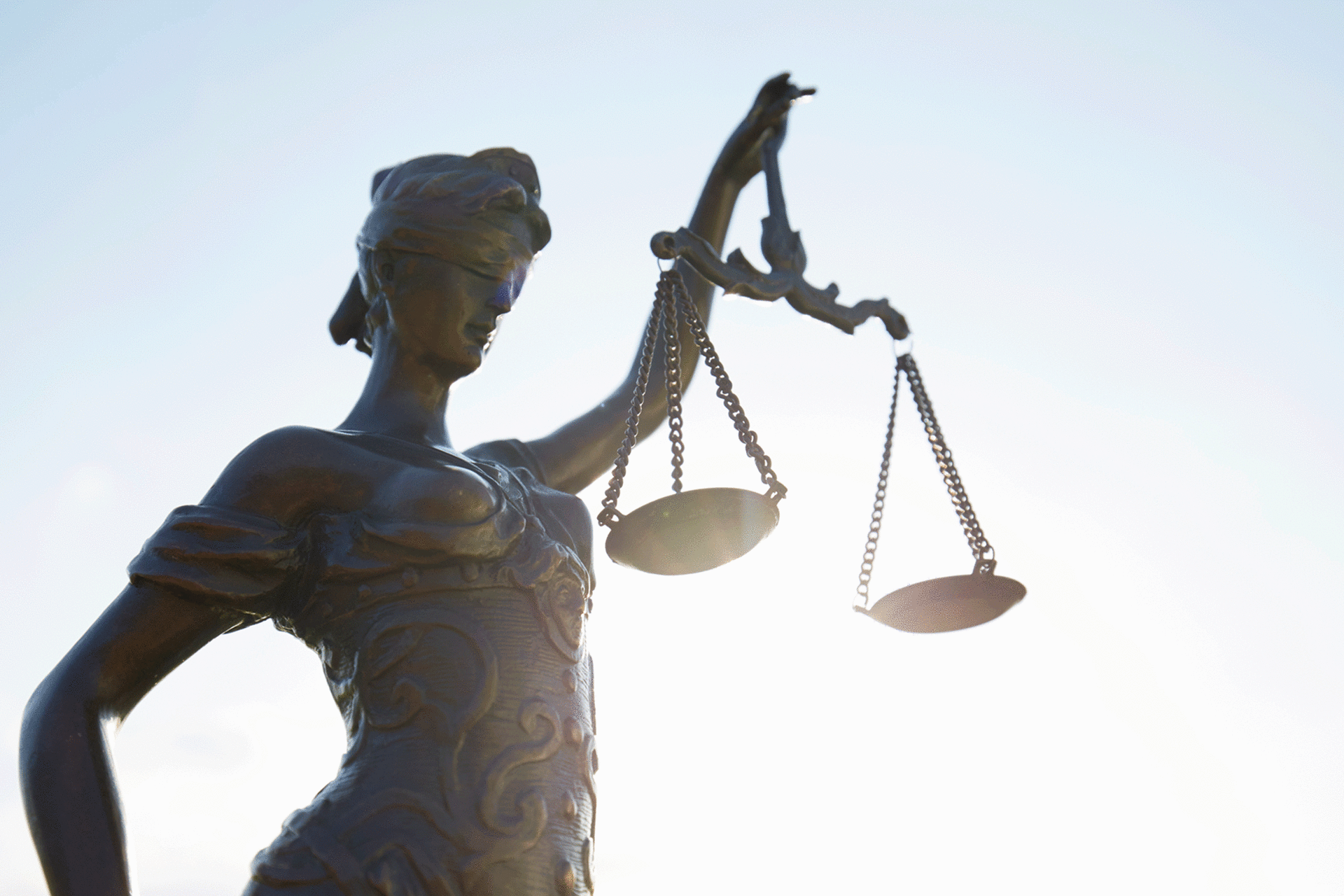 Lady Justice against clear sky