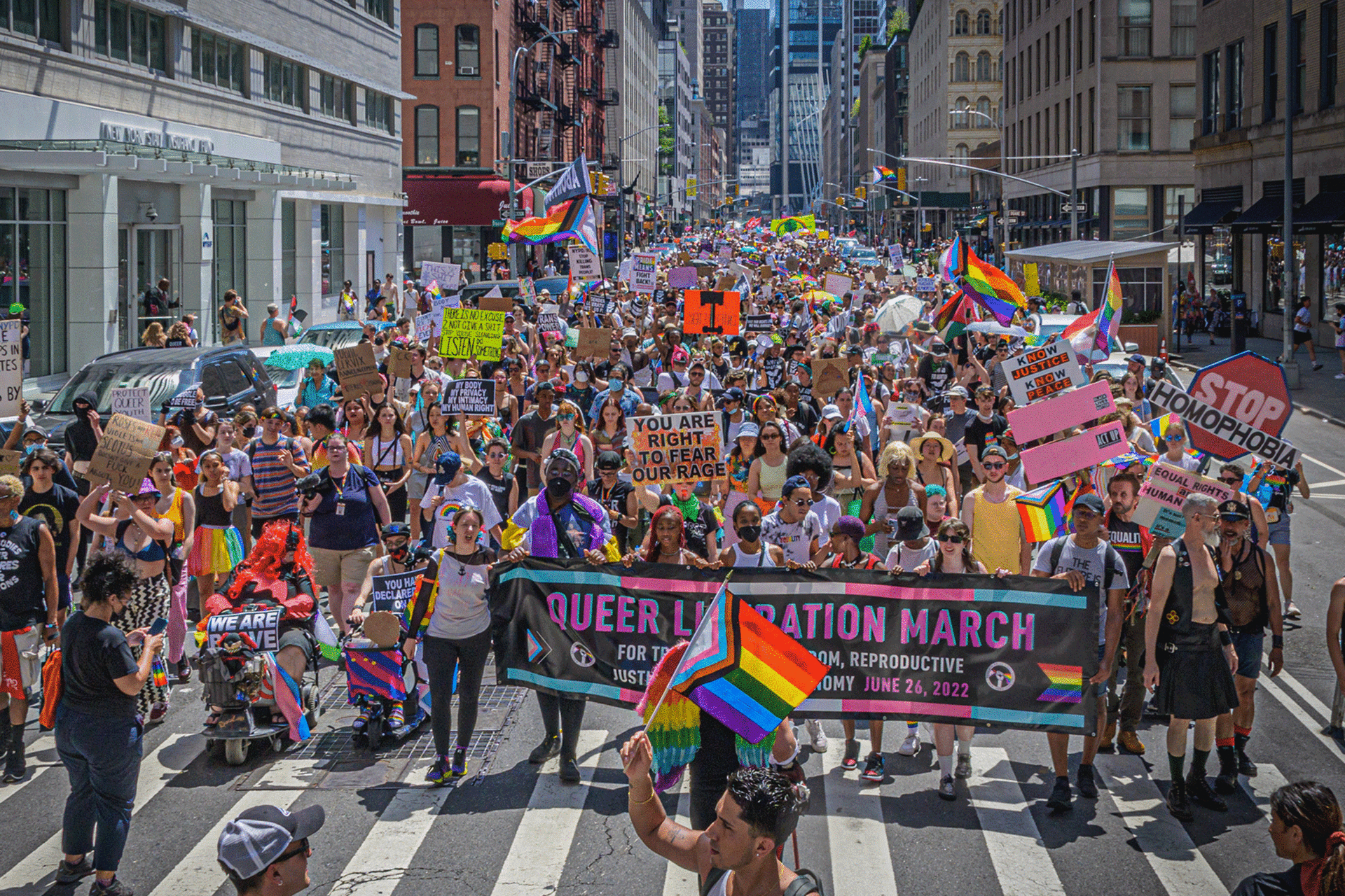 Participants seen holding a banner at the protest