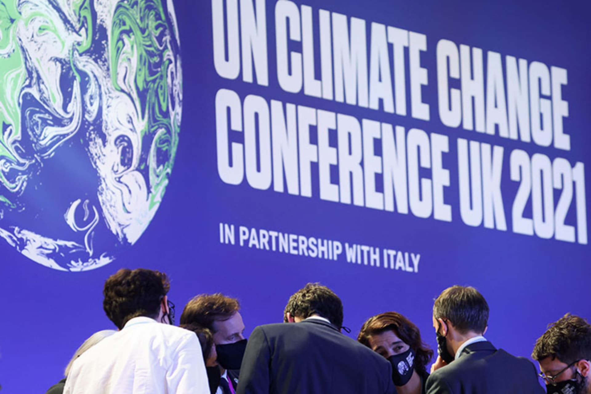 A discussion takes place during COP26