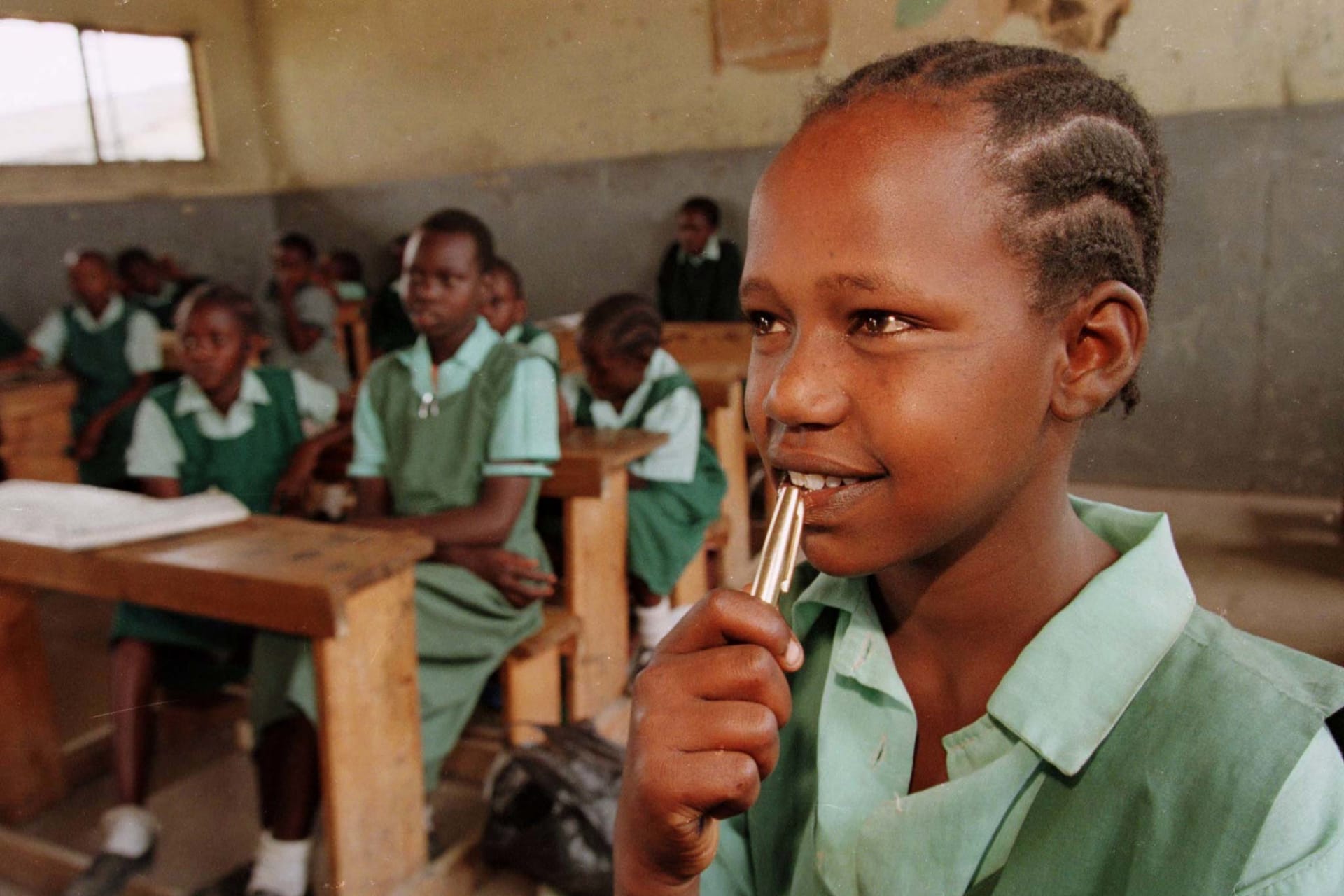 Jedidah Nkadayo, a 12 year old Maasai girl who was rescued from marriage, listens to her teacher at a boarding school in Kajiado, Kenya on January 13, 1999.