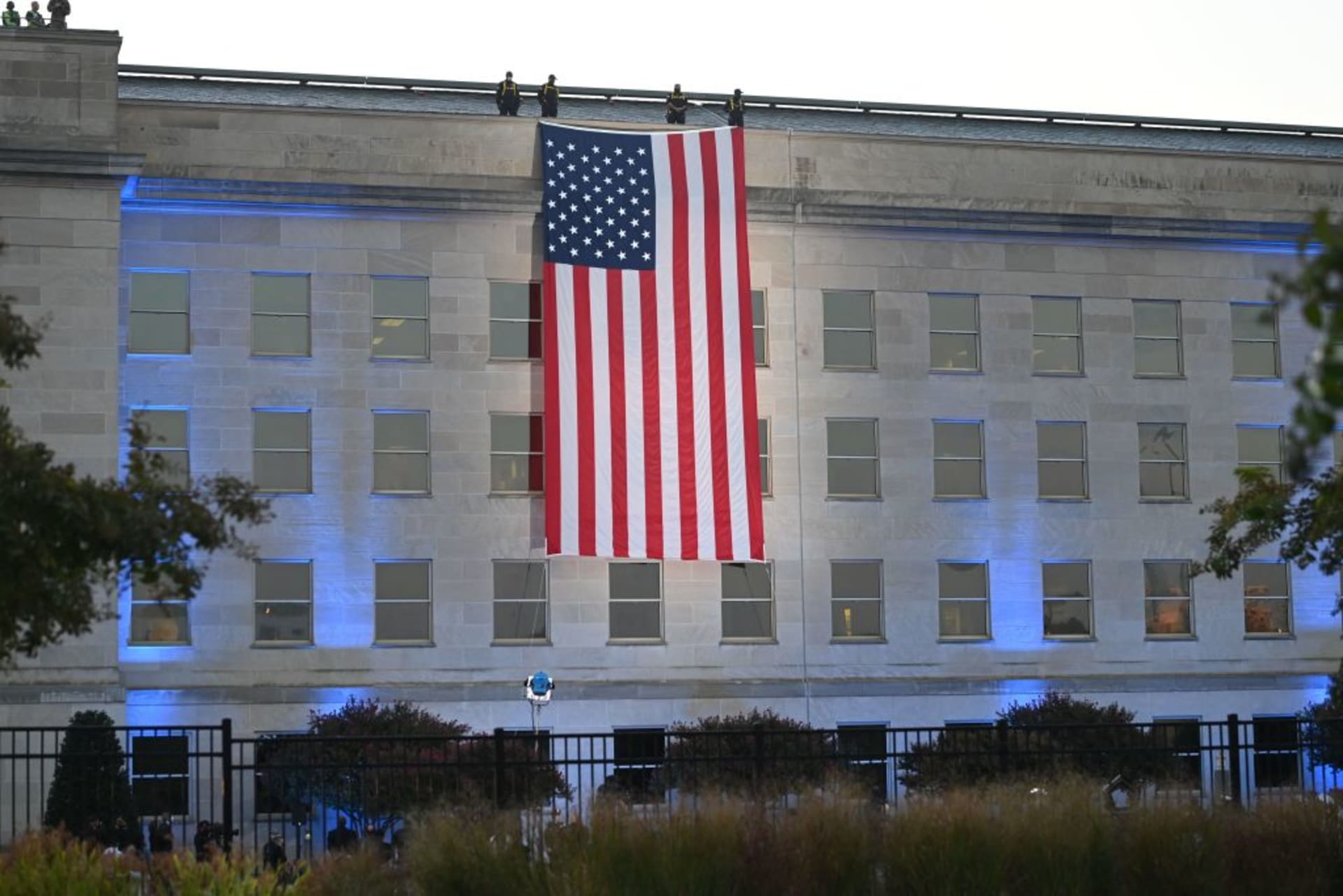 <p>An American flag hangs from the side of the Pentagon to commemorate the 20th anniversary of the 9/11 attacks, on September 11, 2021, in Washington, DC.</p>
