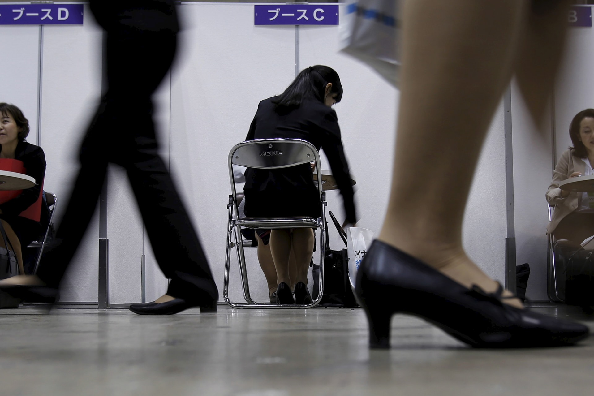 <p>A female job seeker takes part in a job hunting counseling session with advisers during a job fair held for fresh graduates in Tokyo, Japan, March 20, 2016. Picture taken March 20, 2016. </p>