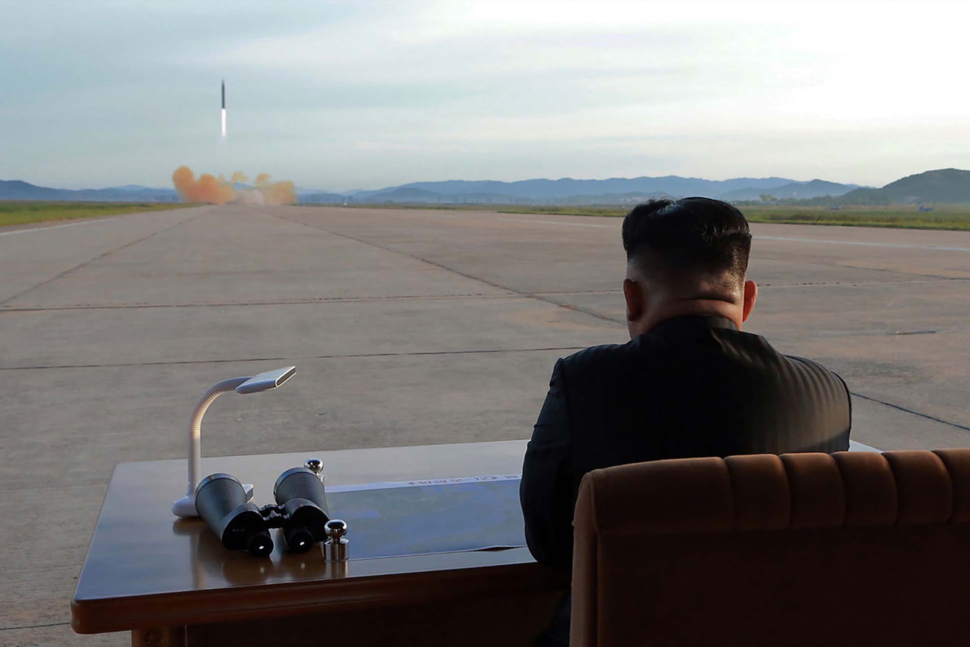 <p>North Korean leader Kim Jong Un looks on during the launch of a Hwasong-12 missile. </p>
