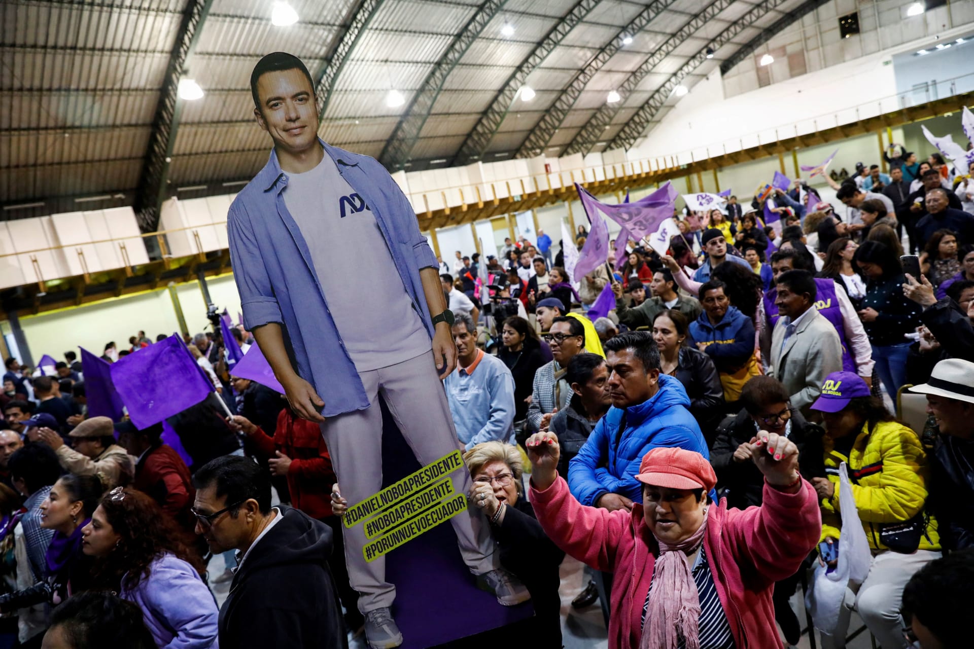 Photo of Ecuadorean Supports of President-Elect Daniel Noboa with a cardboard cutout of Noboa